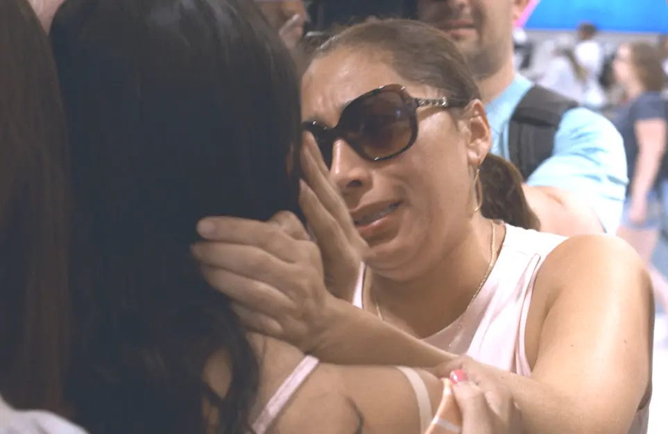 Alejandra Juarez is separated from her family as she boards a plane to Mexico in an image from the new Netflix dicuseries, Living Undocumented. (Photo: Netflix)