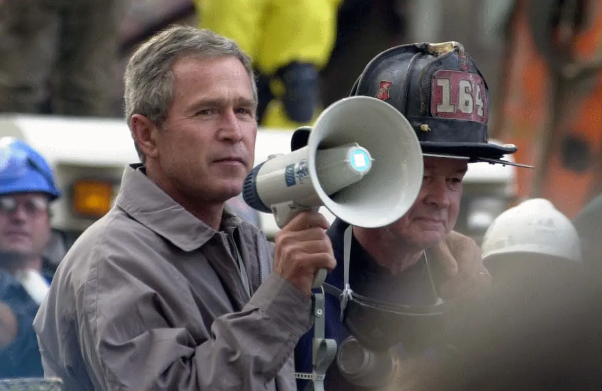 President George W. Bish Bush addresses rescue workers at Ground Zero on September 14, 2001. (Photo: SFC Thomas R. Roberts/ NGB-PASE)	