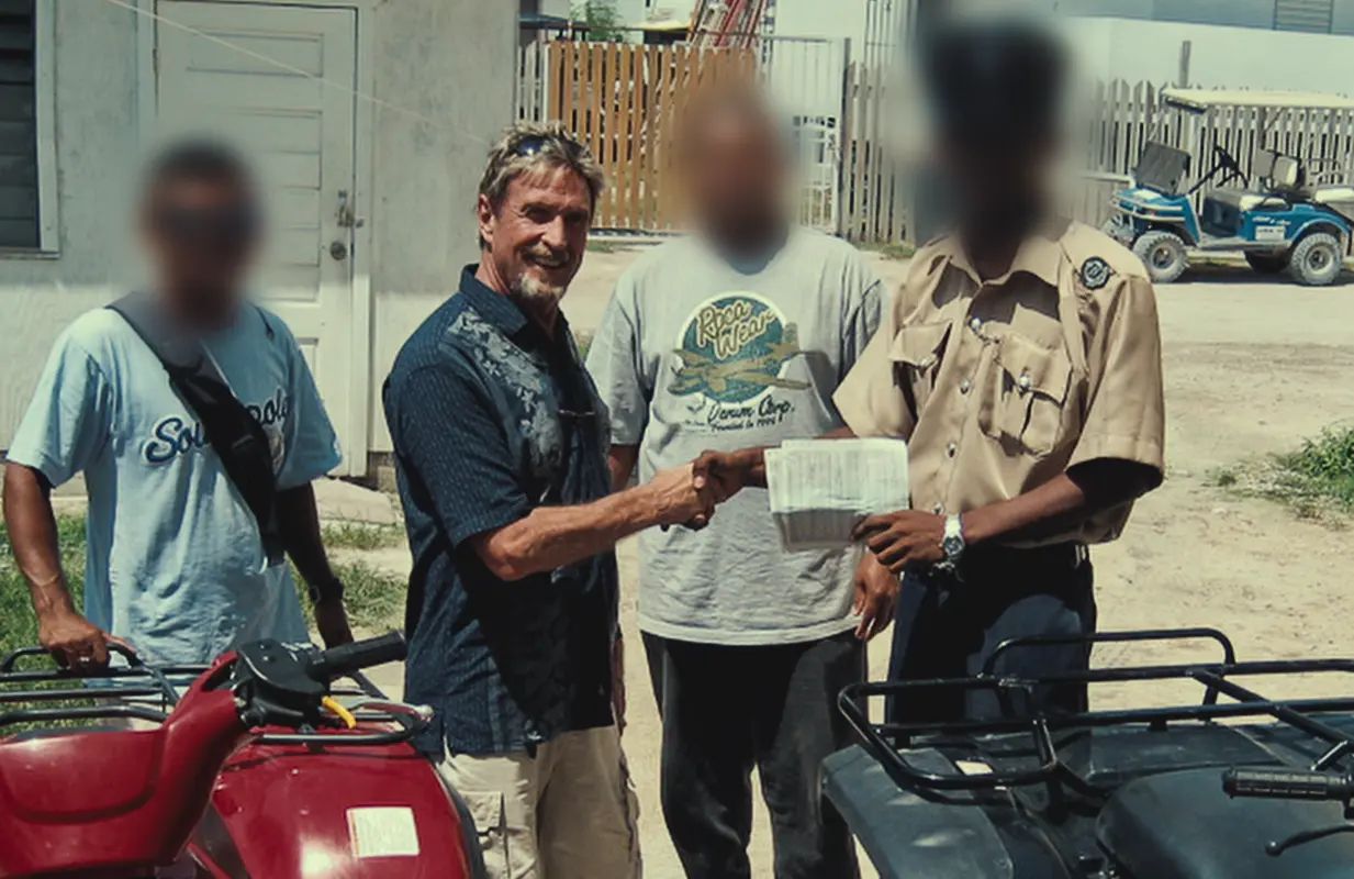 John McAfee with anonymous officials in an image from Running With the Devil: The Wild World of John McAfee. (Courtesy: Netflix)