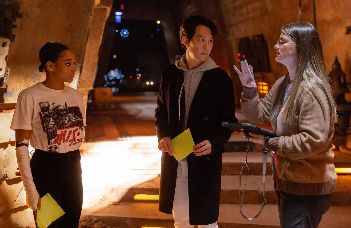Amandla Stenberg, Lee Jung-jae, and Leslye Headland on the set of The Acolyte. (Photo: Disney+)