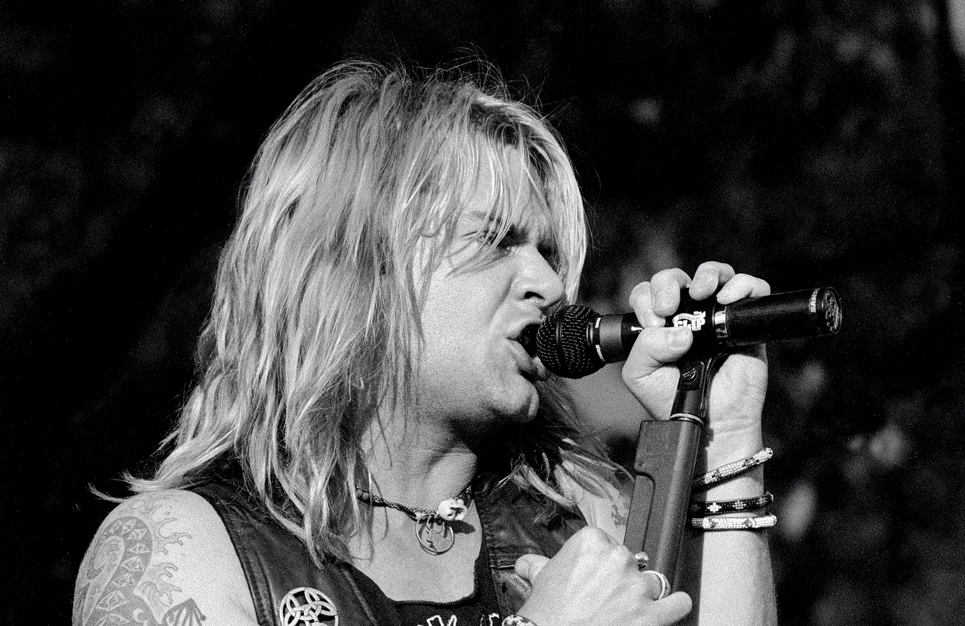 Lead singer David Roach is shown performing on stage during a live concert appearance with Junkyard on July 28, 1991 in Bristol, Connecticut. (Photo by John Atashian/Getty Images)