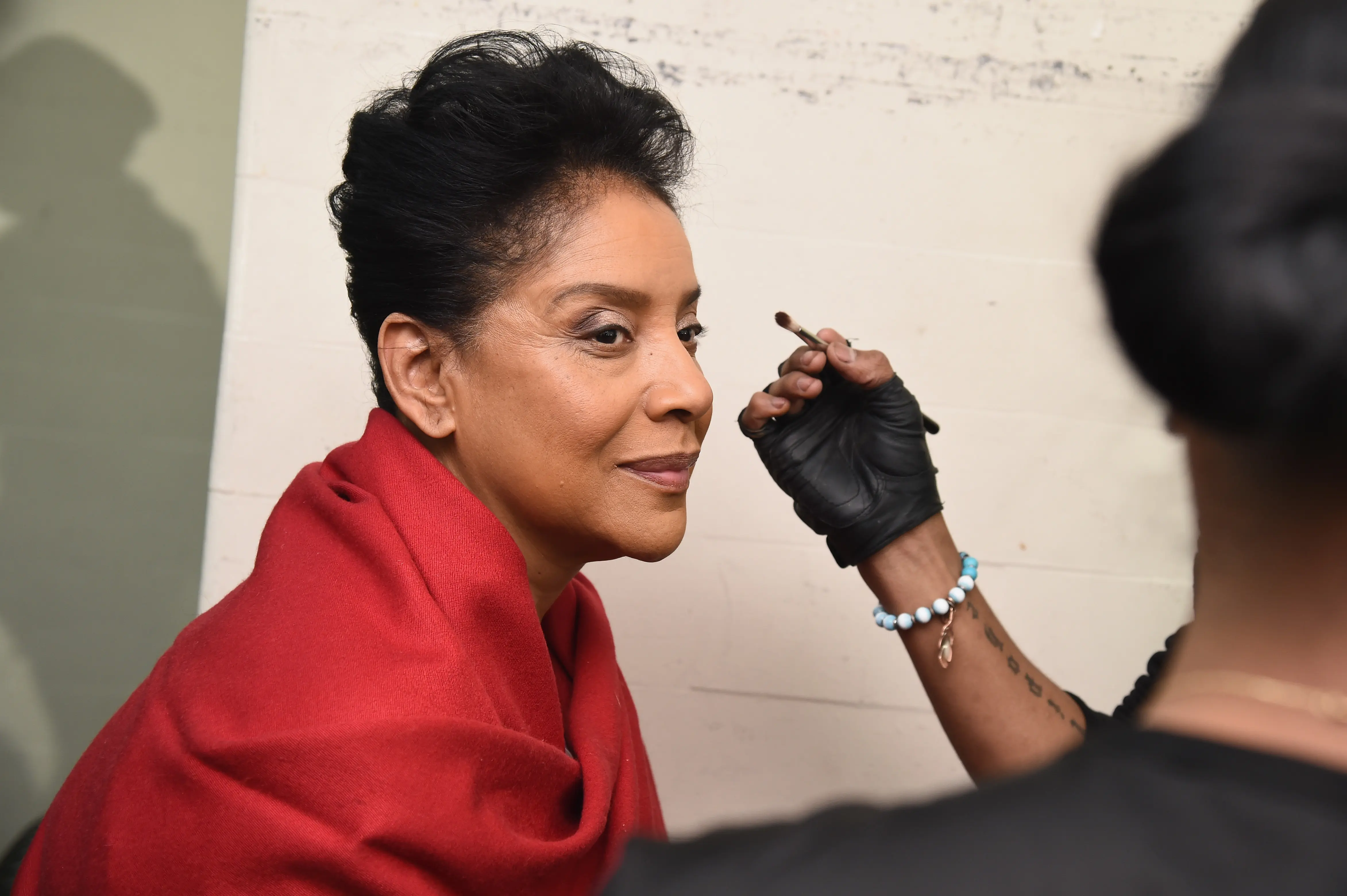 Actress Phylicia Rashad prepares backstage at the B Michael America fashion show during Mercedes-Benz Fashion Week Fall 2015 at New York Public Library(Photo by Ilya S. Savenok/Getty Images for Mercedes-Benz Fashion Week)