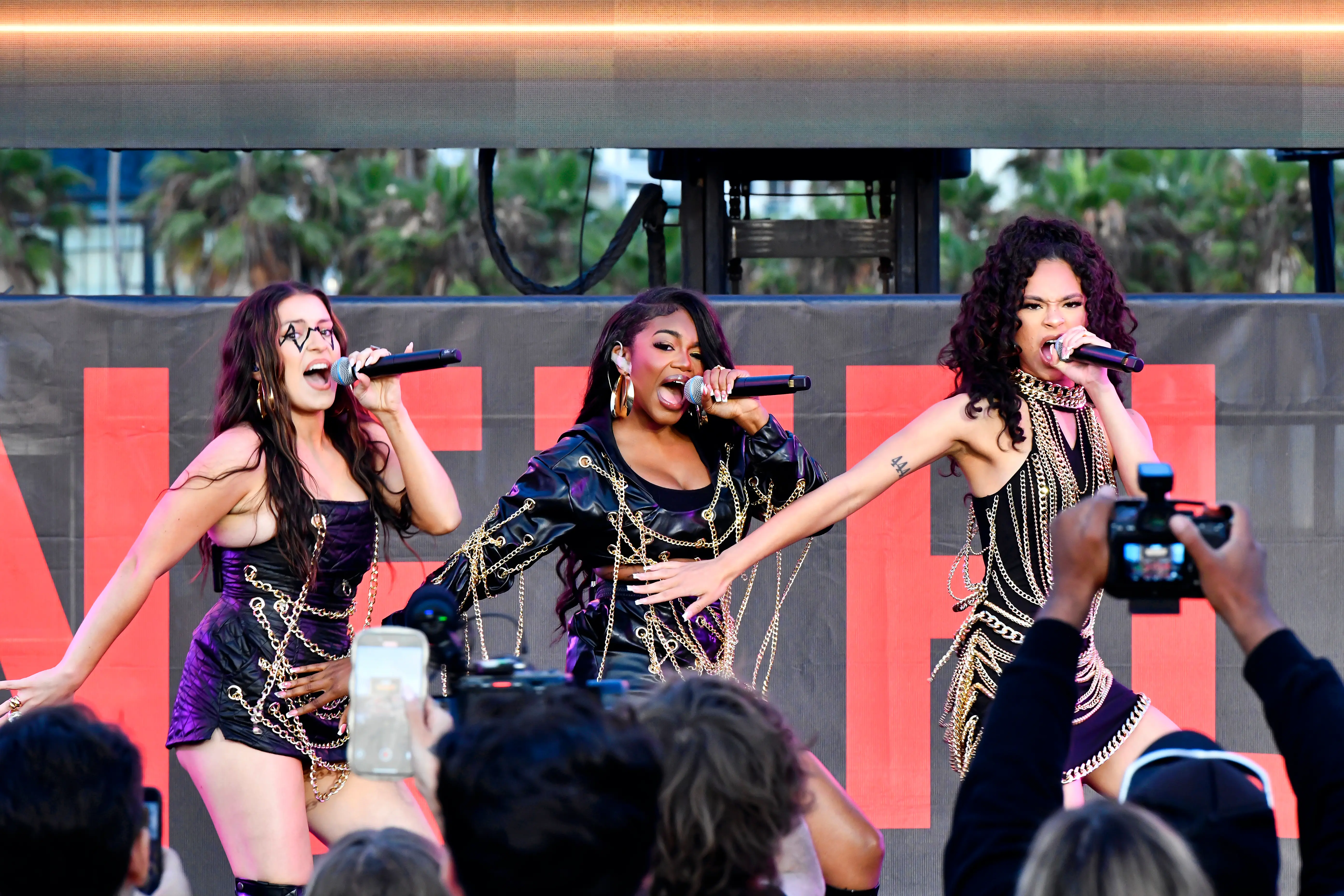  Brianna Mazzola, Nori Moore and Wennely Quezada of 3Quency perform onstage during Netflix Summer Break (Image via Getty)