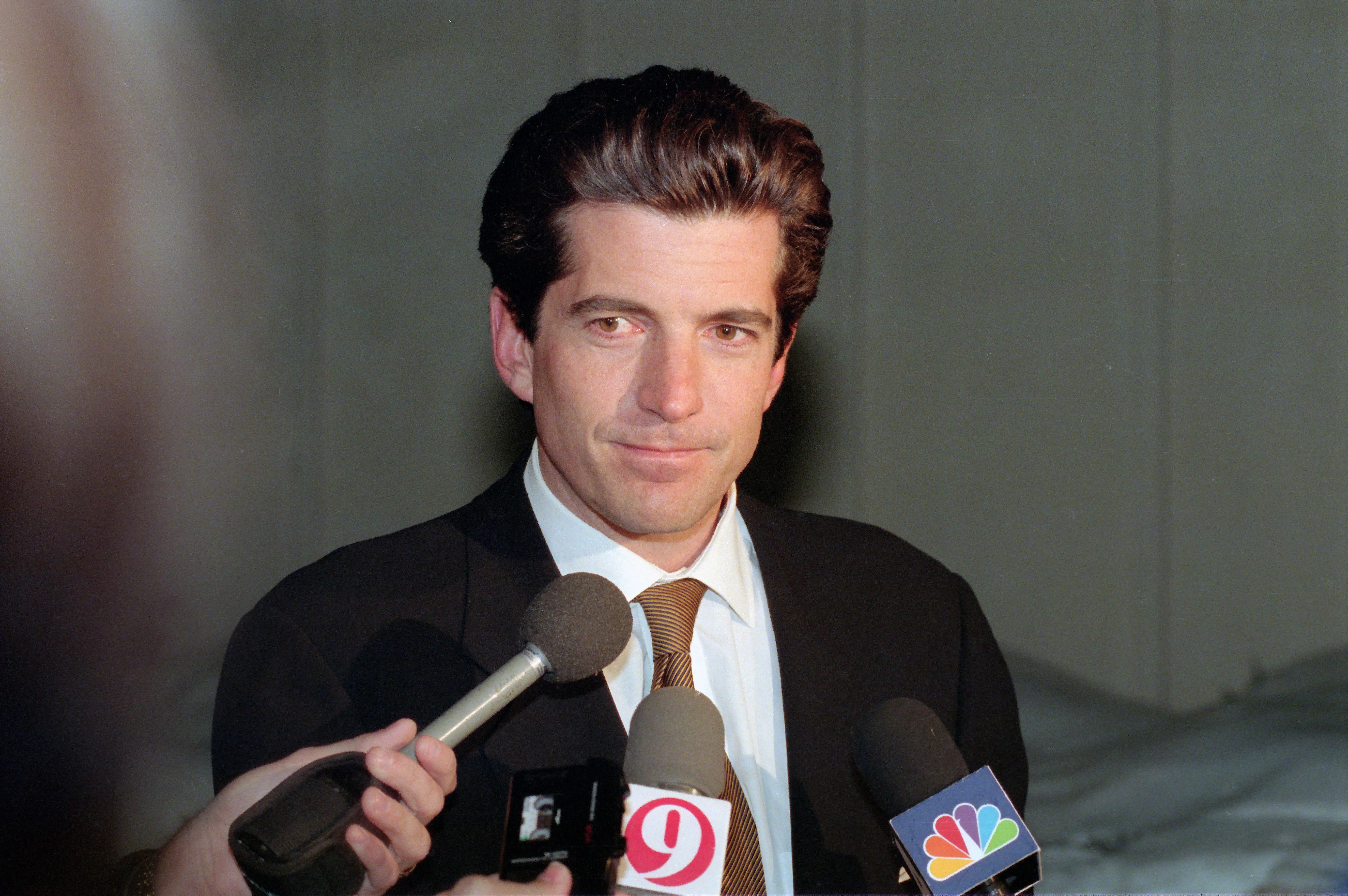 American magazine publisher John F Kennedy Jr  (1960 - 1999) speaks to reporters at the Montgomery County Detention Center, Rockville, Maryland, March 11, 1999. Kennedy was there for a meeting with boxer and convict Mike Tyson. (Photo by Ron Sachs/CNP/Getty Images)