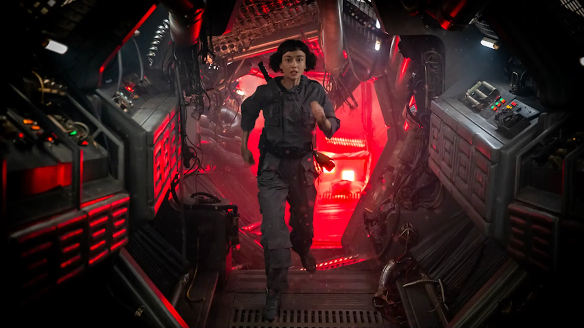 Wendy (Sydney Chandler) sprints through a red-lit corridor during the New Siam recovery in Alien: Earth Episode 3 Metamorphosis.Image Courtesy: FX / Hulu