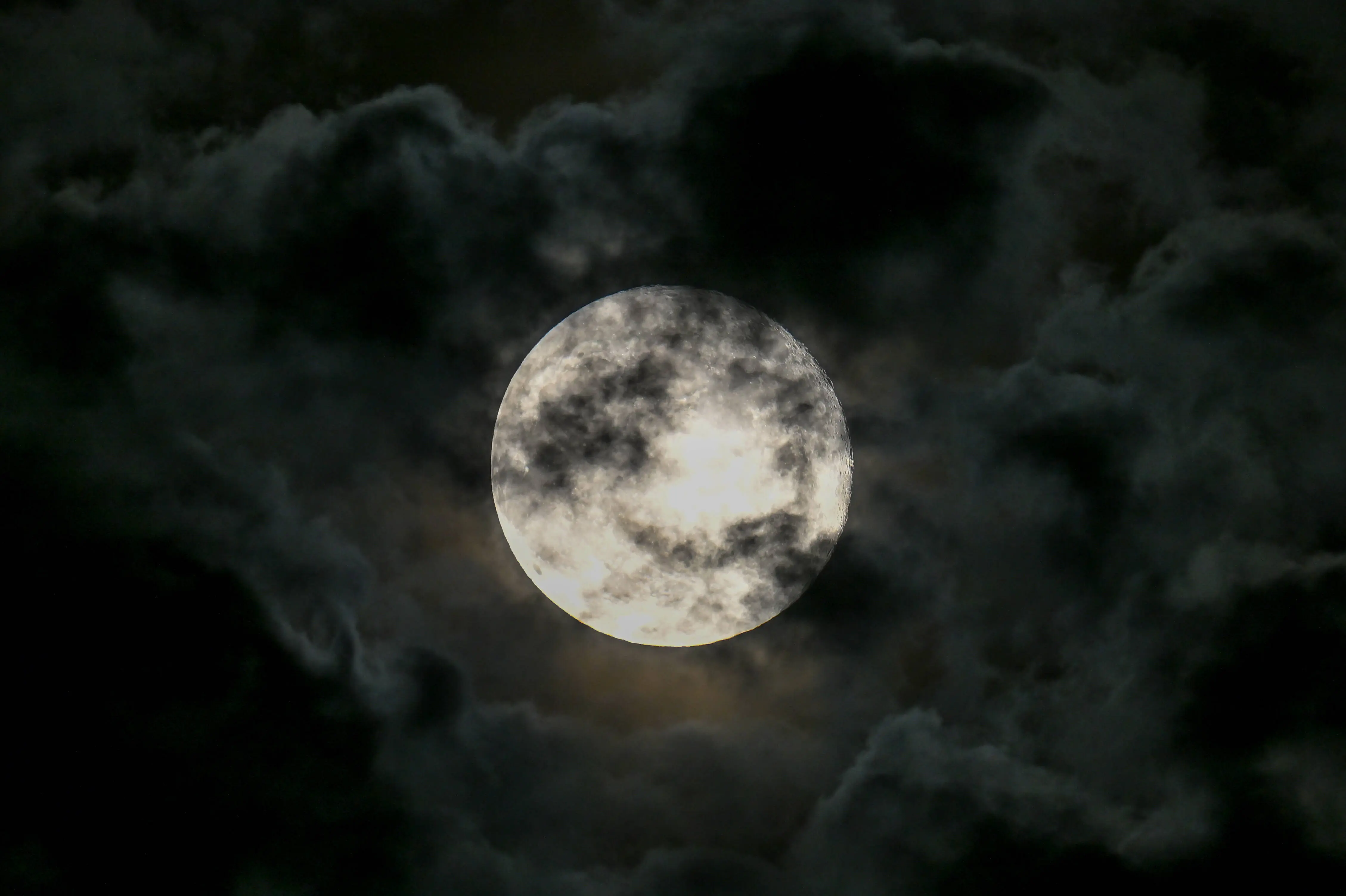 SAN MATEO, CALIFORNIA - SEPTEMBER 18: Full harvest moon rises over San Francisco Bay during cloudy skies in San Mateo, California, United States on September 18, 2024. (Photo by Tayfun Coskun/Anadolu via Getty Images)