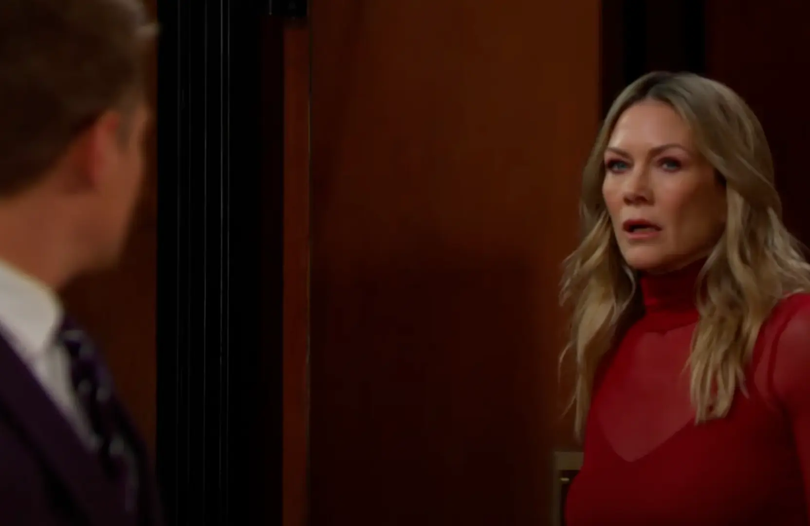 A still of Kristen facing Johnny (Image via Youtube / Days of Our Lives)