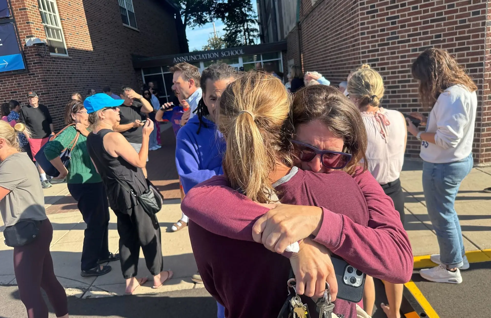 Parents awaiting news of their children's status after shooting at Annunciation Church on Wednesday morning, Aug. 27, 2025 in Minneapolis (Image via Getty)