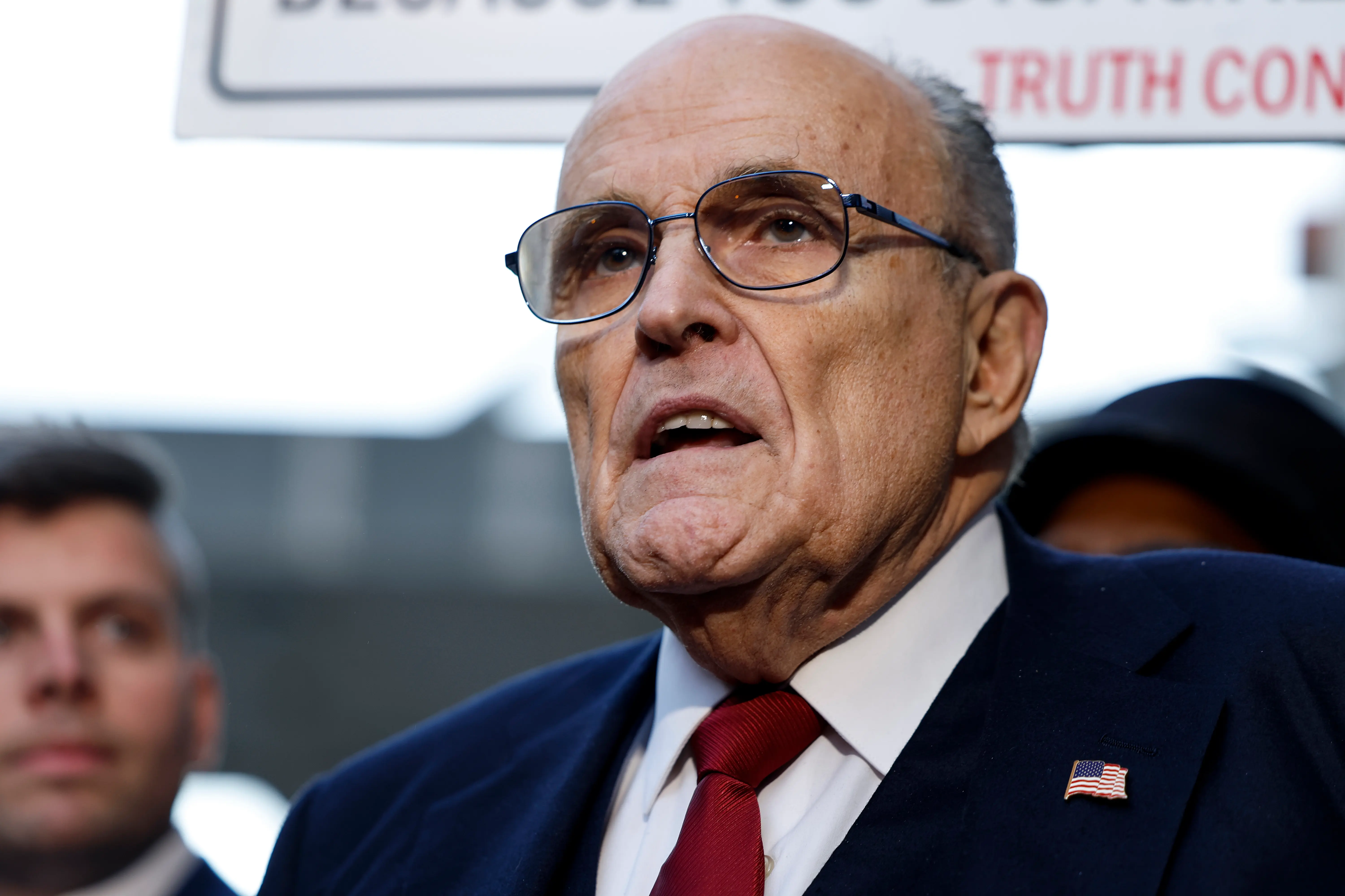 Rudy Giuliani speaks with reporters outside of the E. Barrett Prettyman U.S. District Courthouse (Image via Getty)
