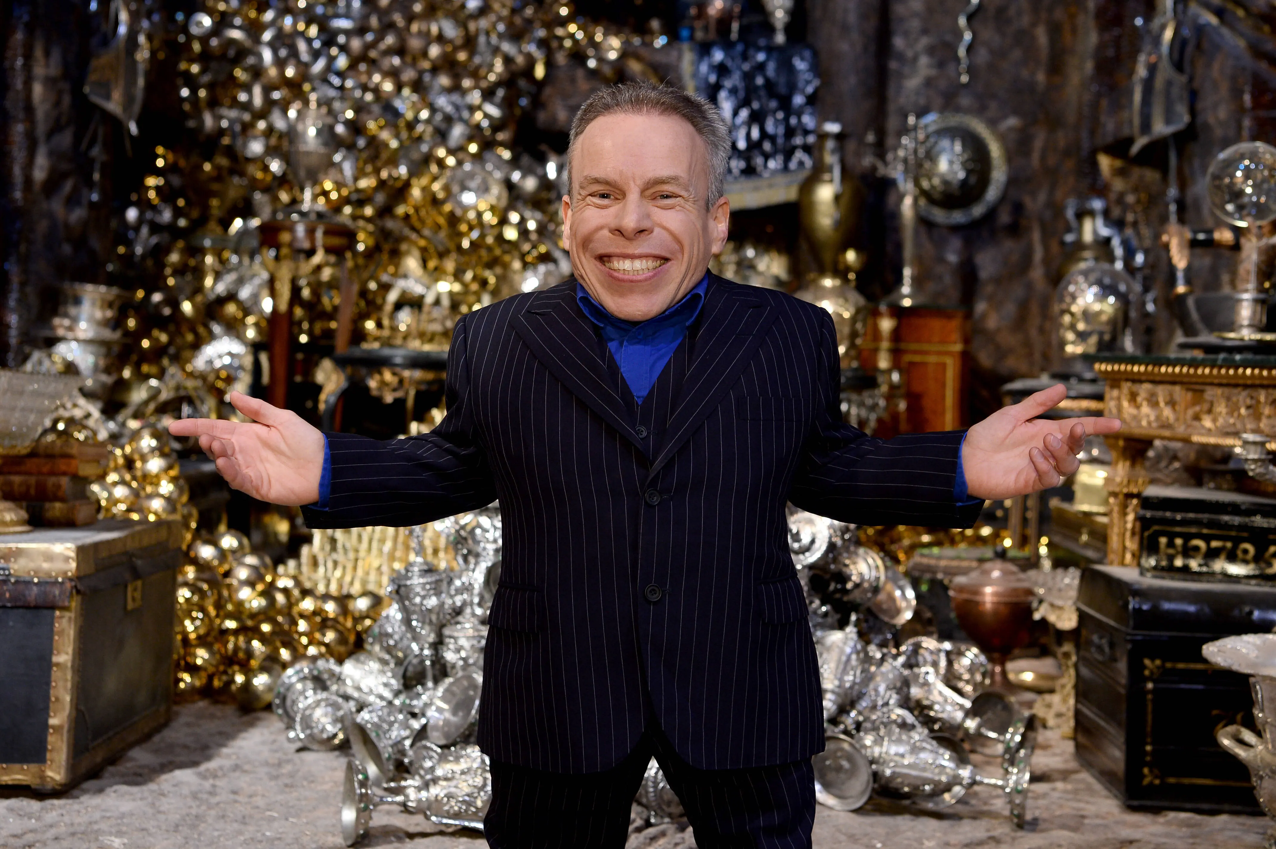 WATFORD, ENGLAND - MARCH 19:  Warwick Davis in the Lestrange Vault set at the original Gringotts Wizarding Bank at Warner Bros. Studio Tour London on March 19, 2019 in Watford, England. Warner Bros. Studio Tour London – The Making of Harry Potter unveils its biggest expansion to date, the original Gringotts Wizarding Bank will be open to the public from Saturday 6th April. (Photo by Jeff Spicer/Getty Images for Warner Bros. Studio Tour London)