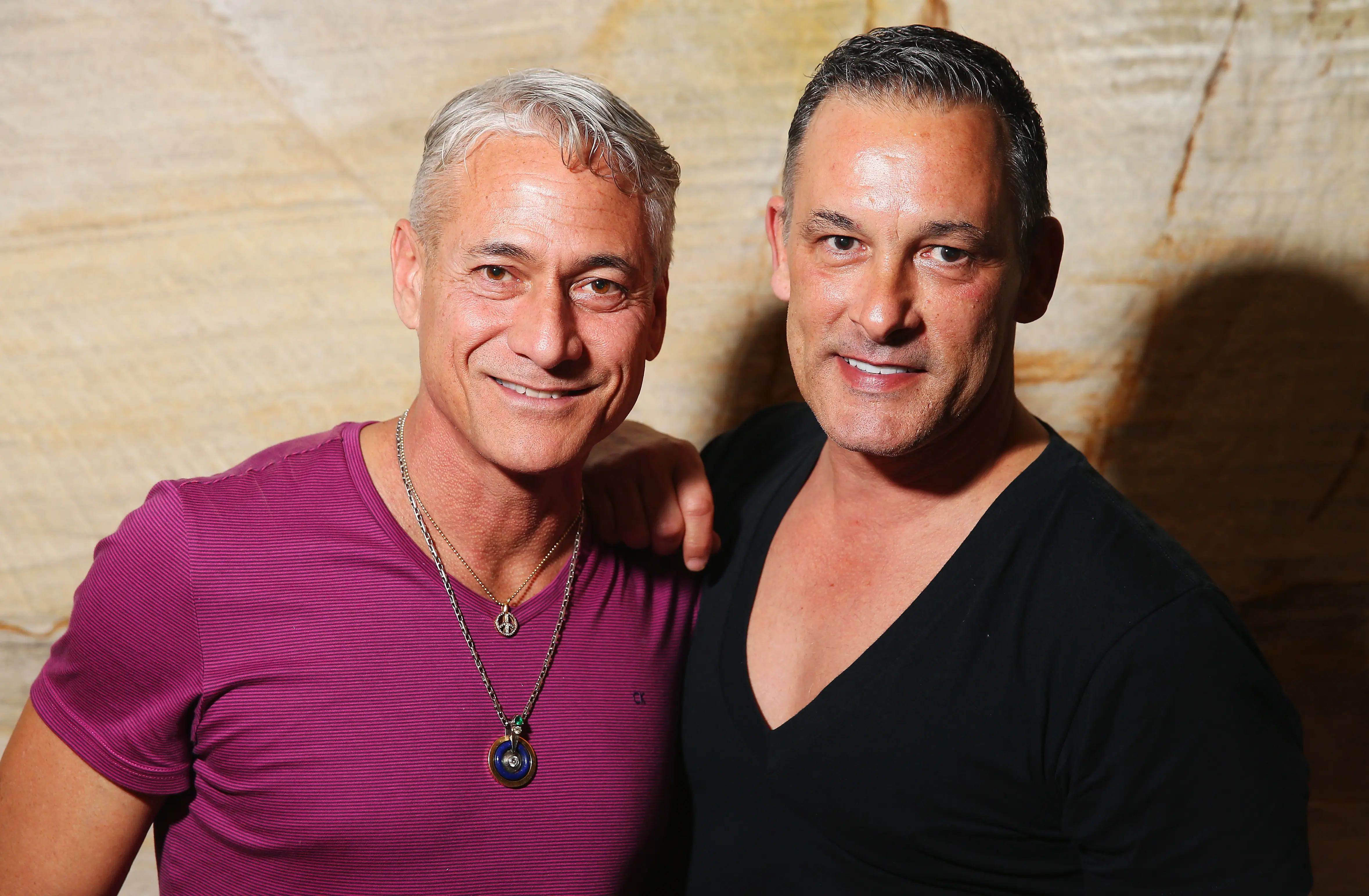 Greg Louganis poses alongside Johnny Chaillot during a Speak Out event (Image via Getty)