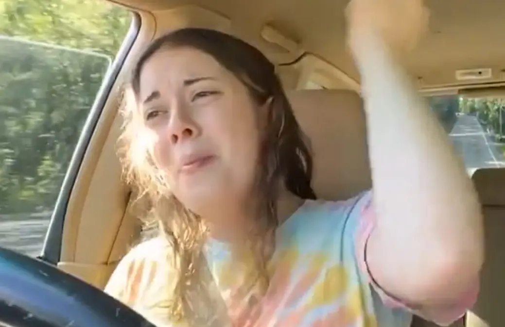 Kaitlynn driving a car (Image via X/@CollinRugg)