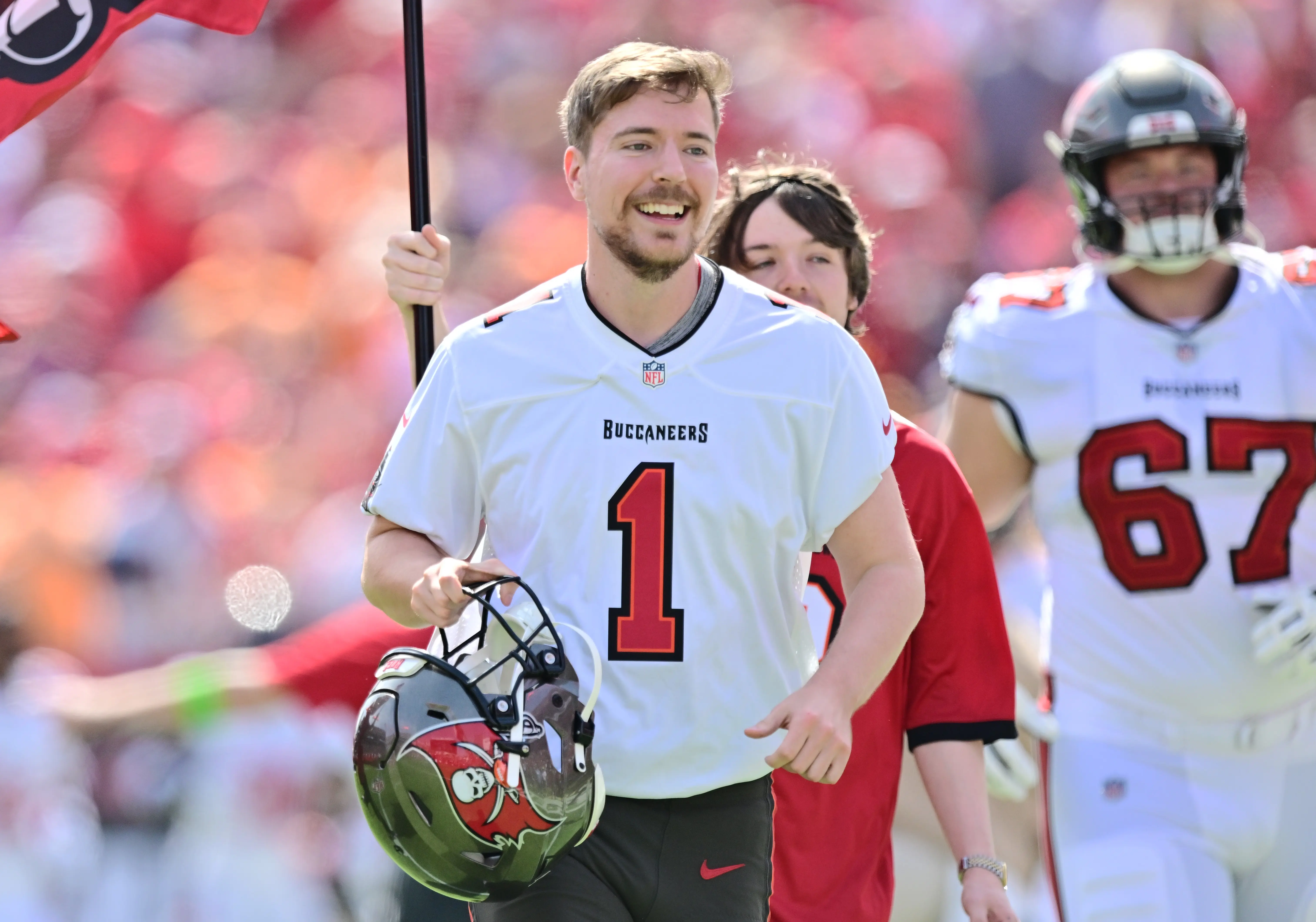 MrBeast runs on to the field prior to a game between the Tampa Bay Buccaneers and the Atlanta Falcons at Raymond James Stadium on October 22, 2023 in Tampa, Florida. (Photo by Julio Aguilar/Getty Images)