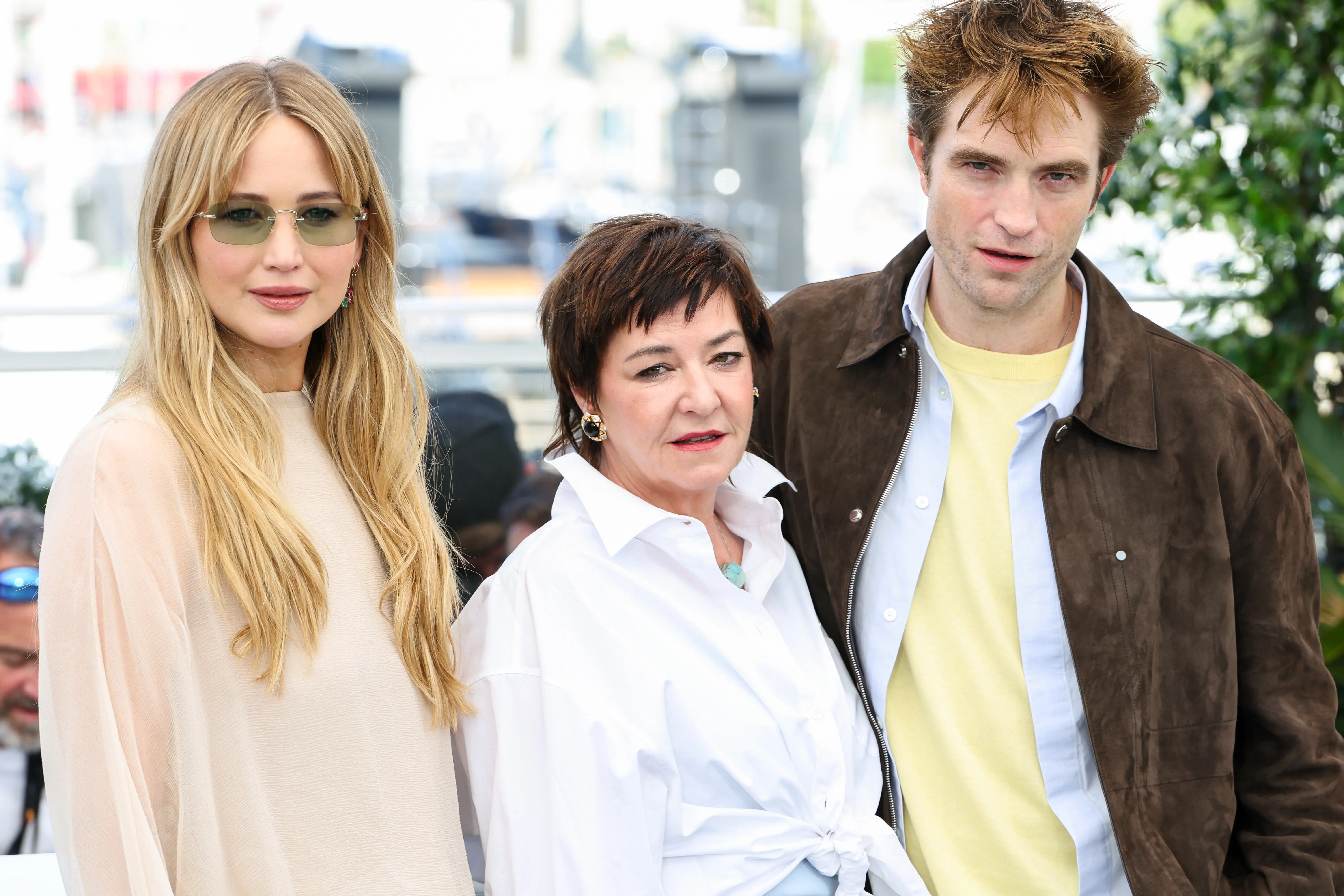 CANNES, FRANCE - MAY 18: (L-R) Jennifer Lawrence, Lynne Ramsay and Robert Pattinson pose during the "Die My Love" photocall at the 78th annual Cannes Film Festival at Palais des Festivals on May 18, 2025 in Cannes, France. (Photo by Lyvans Boolaky/Getty Images)