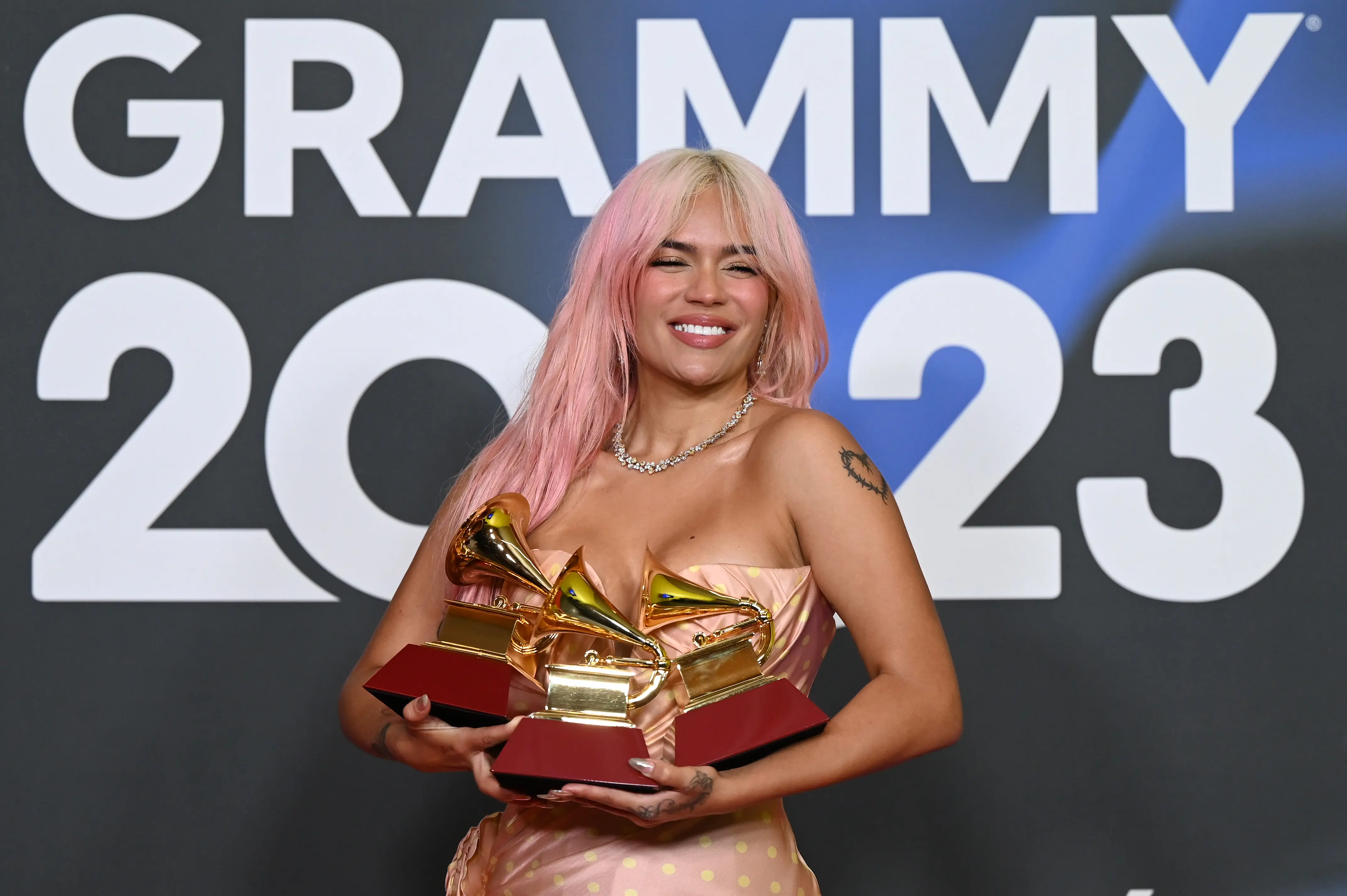 Karol G poses with awards during The 24th Annual Latin Grammy Awards on November 16, 2023 in Seville, Spain (Image via Getty)