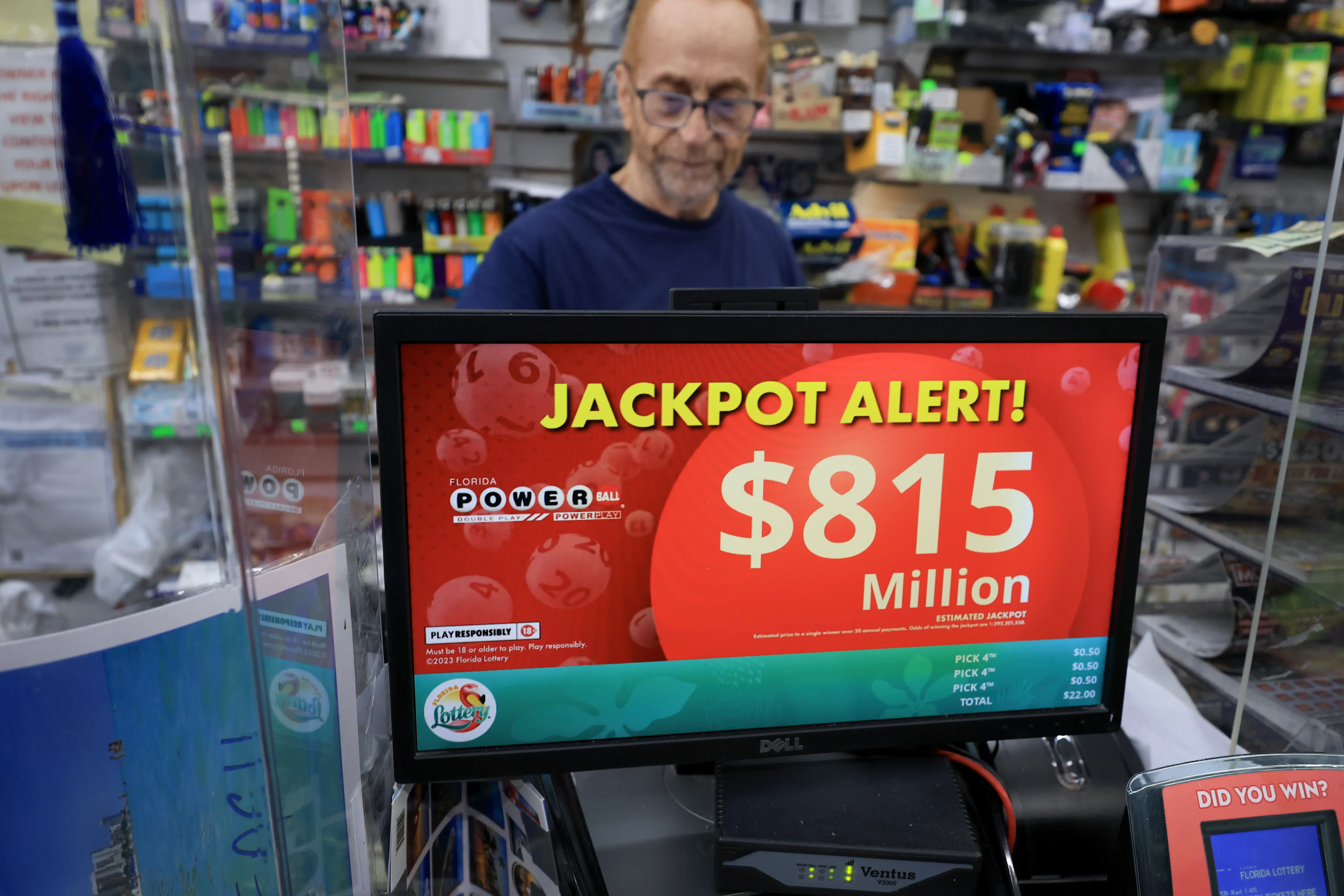 MIAMI, FLORIDA - AUGUST 26:  Robert Hadad sells Powerball lottery tickets at his Downtown Miami Souvenirs store on August 26, 2025 in Miami, Florida. The Powerball jackpot has climbed to $815 million ahead of Wednesday's drawing, making the jackpot the 10th-largest in Powerball history. (Photo by Joe Raedle/Getty Images)
