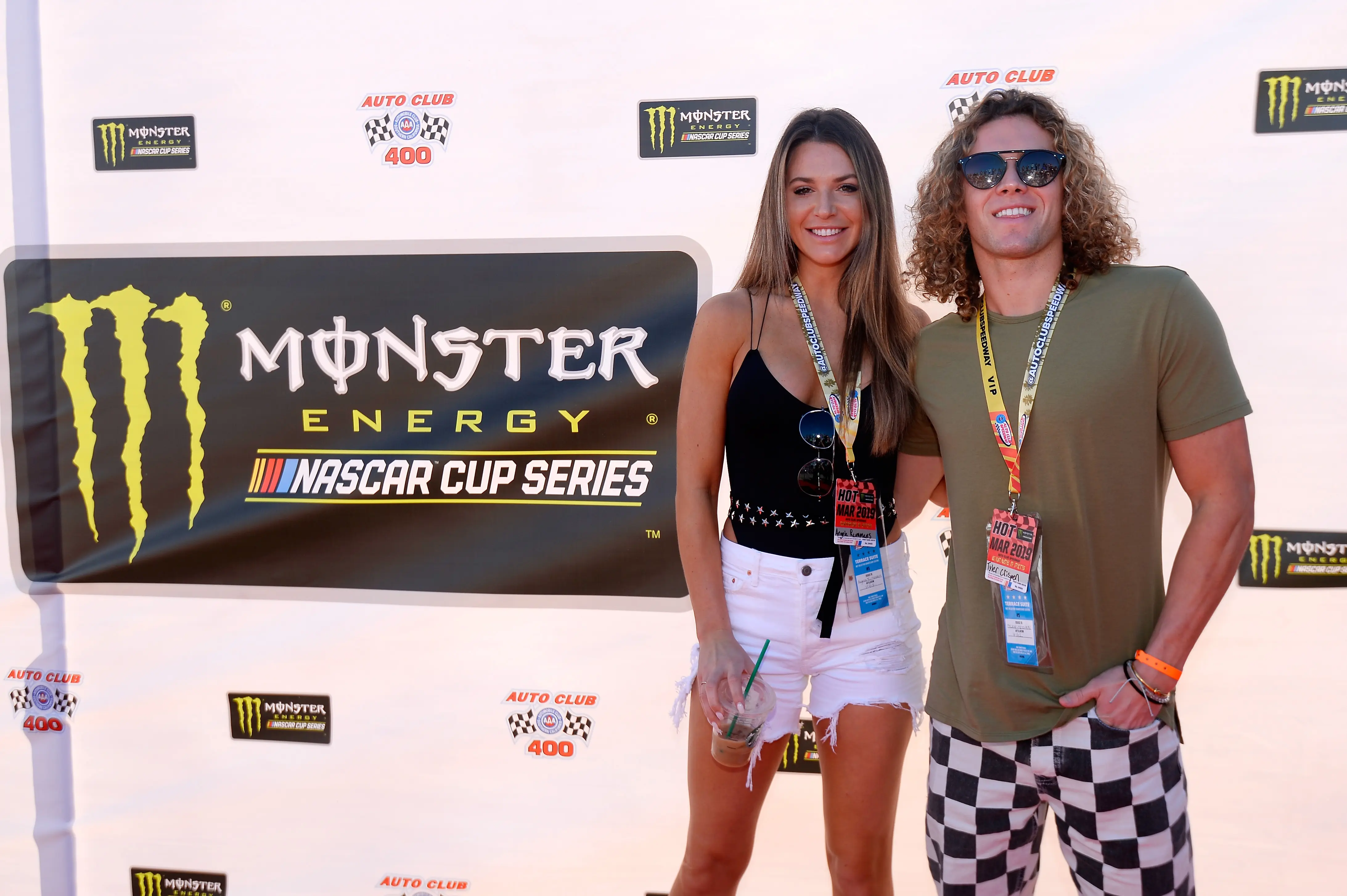 Angela Rummans and Tyler Crispen attend the driver's meeting prior to the Monster Energy NASCAR Cup Series Auto Club 400 at Auto Club Speedway (Image via Getty).