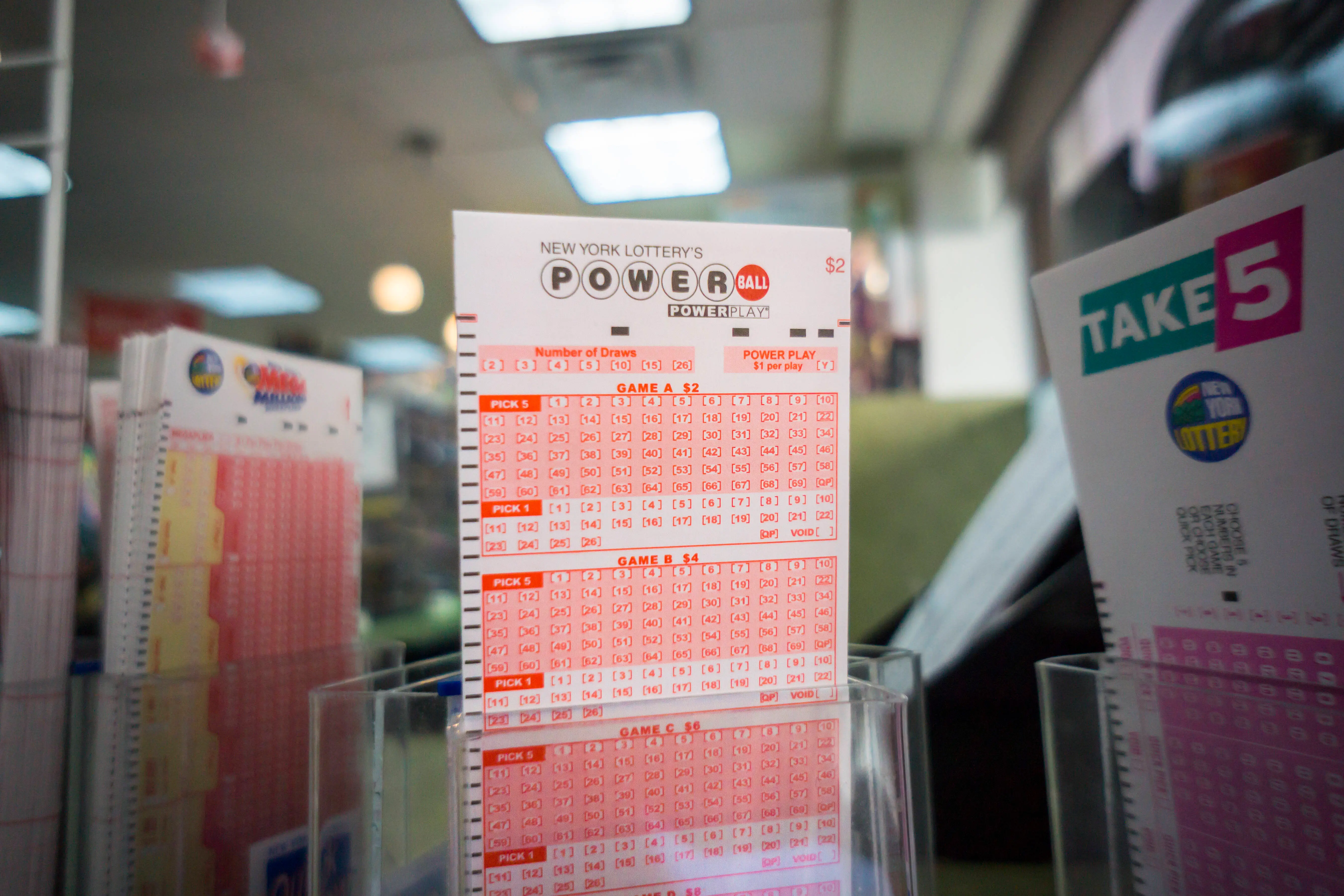 Powerball tickets on a convenience store shelf to enter for an estimated $1.3 billion jackpot, seen on Monday, January 11, 2016. The jackpot has rolled over 18 times with no winner with the next drawing Wednesday. (�� Richard B. Levine) (Photo by Richard Levine/Corbis via Getty Images)