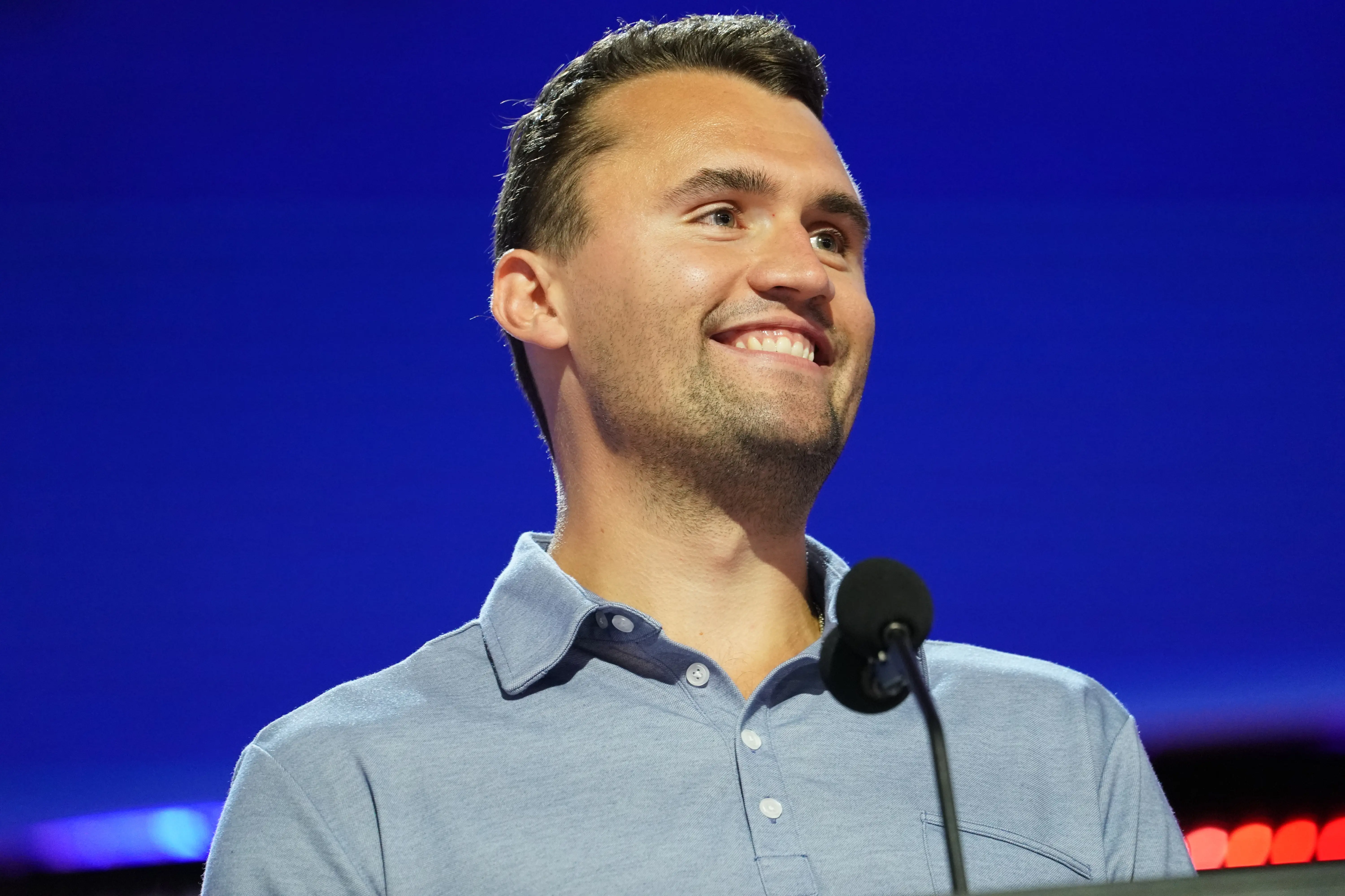 Turning Point USA Founder Charlie Kirk is seen onstage at the Fiserv Forum (Image via Getty)