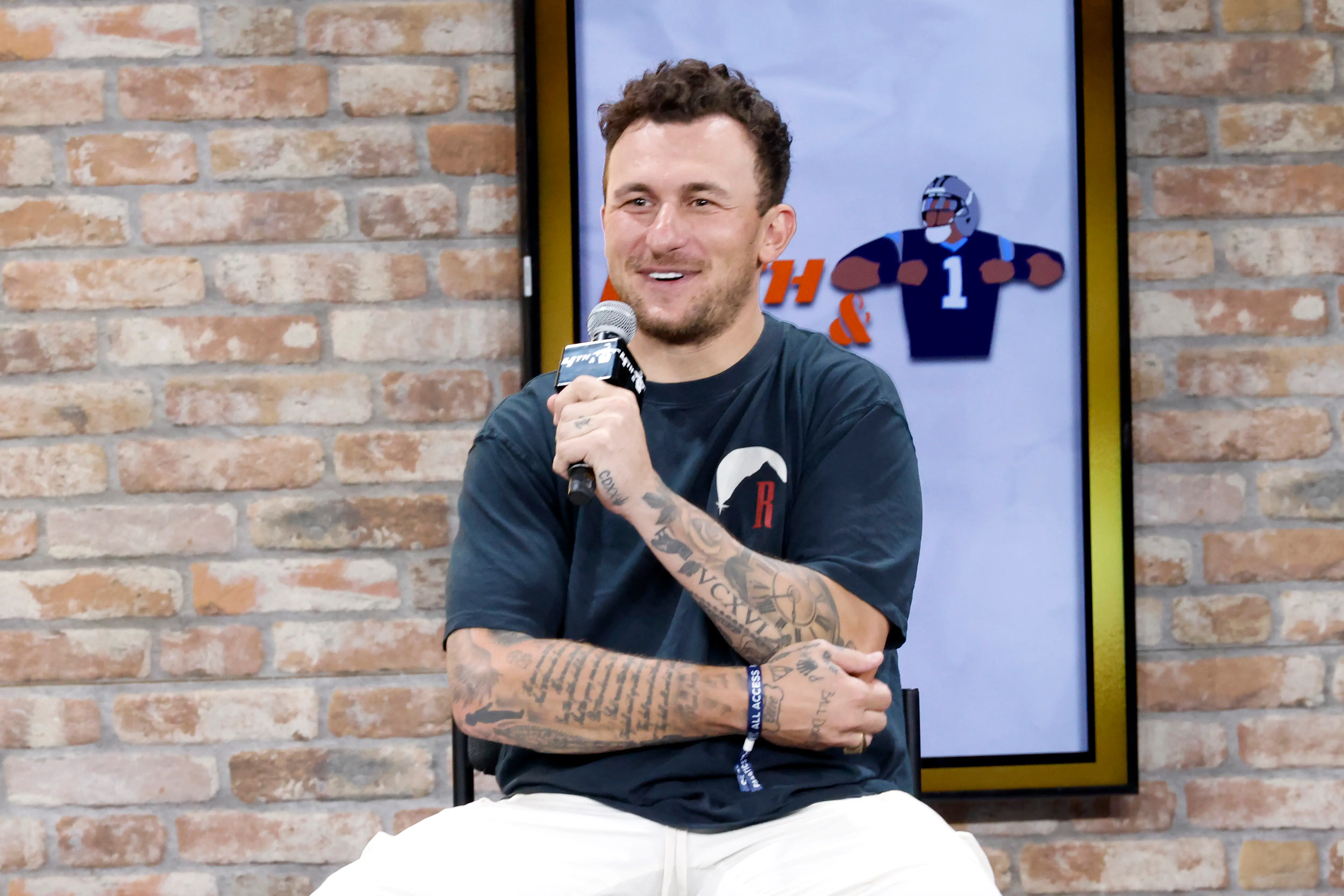 Johnny Manziel speaks onstage at the Fanatics Fest NYC 2024 at Jacob Javits Center (Image via Getty).