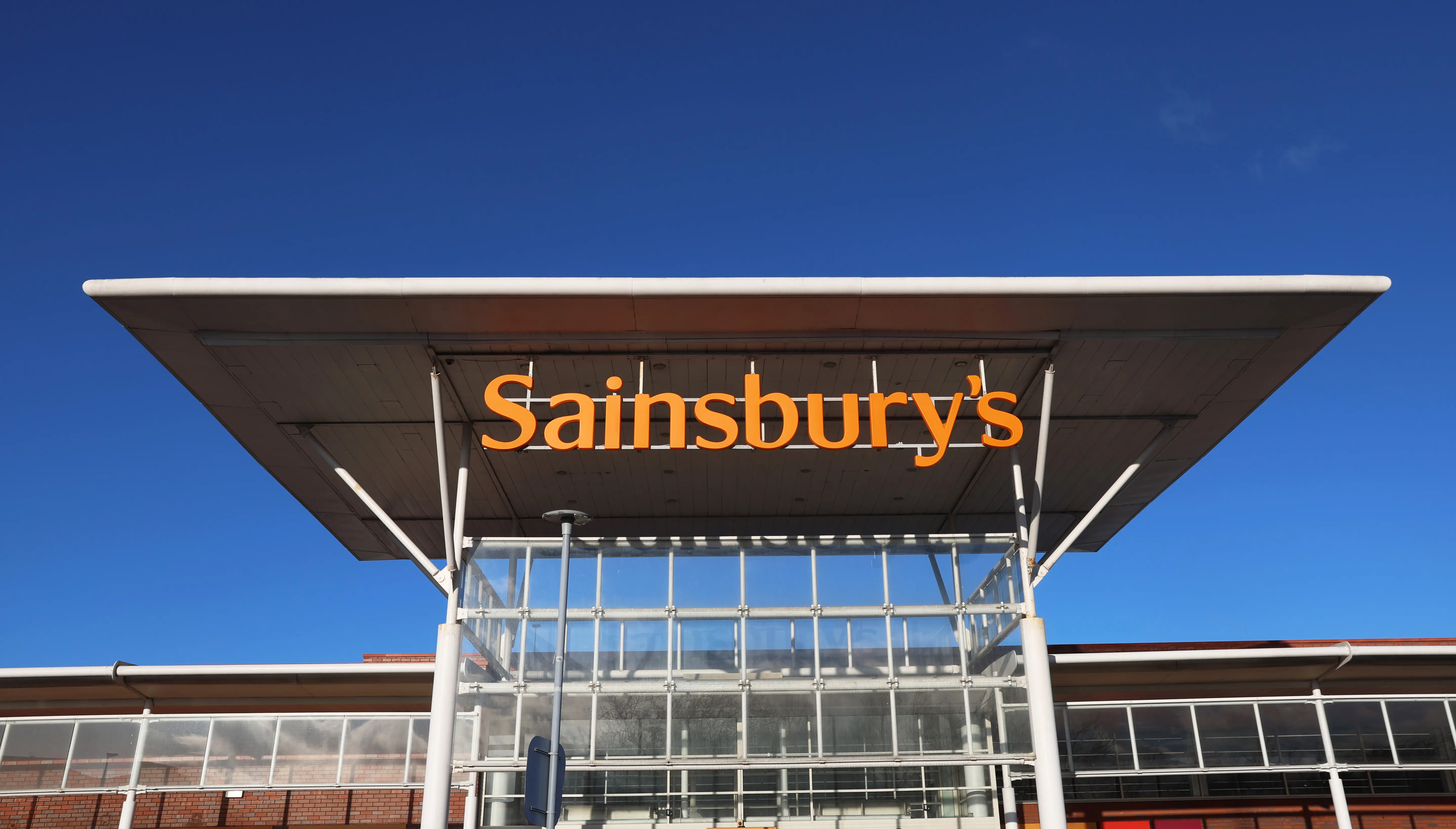 WARRINGTON, ENGLAND - DECEMBER 13: A general view outside an Sainsbury's store on December 13, 2023 in Warrington, United Kingdom. (Photo by Nathan Stirk/Getty Images)