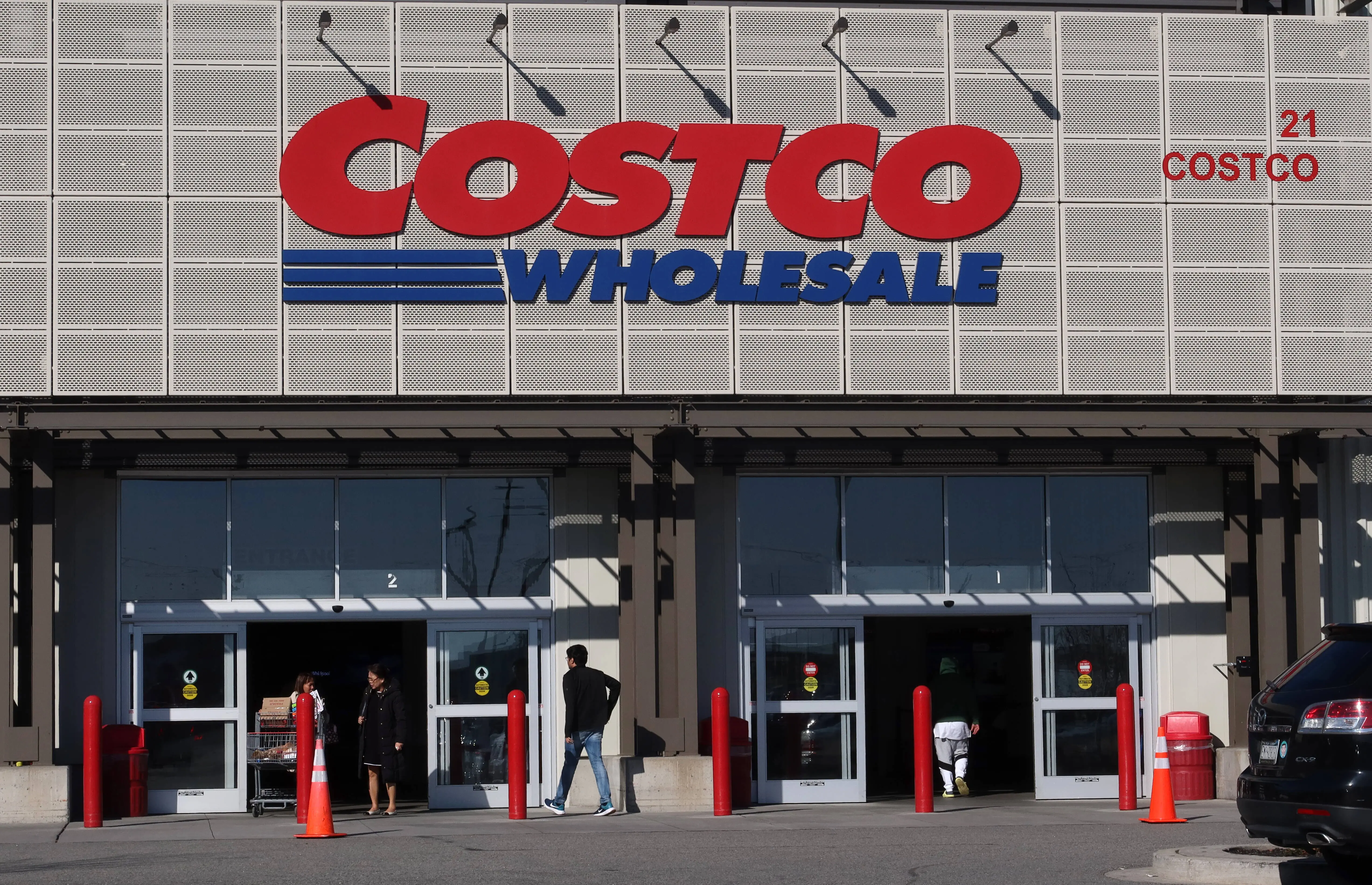 BAYONNE, NJ - MARCH 26: People enter and exit a Costco Wholesale store on March 26, 2023, in Bayonne, New Jersey.  (Photo by Gary Hershorn/Getty Images)