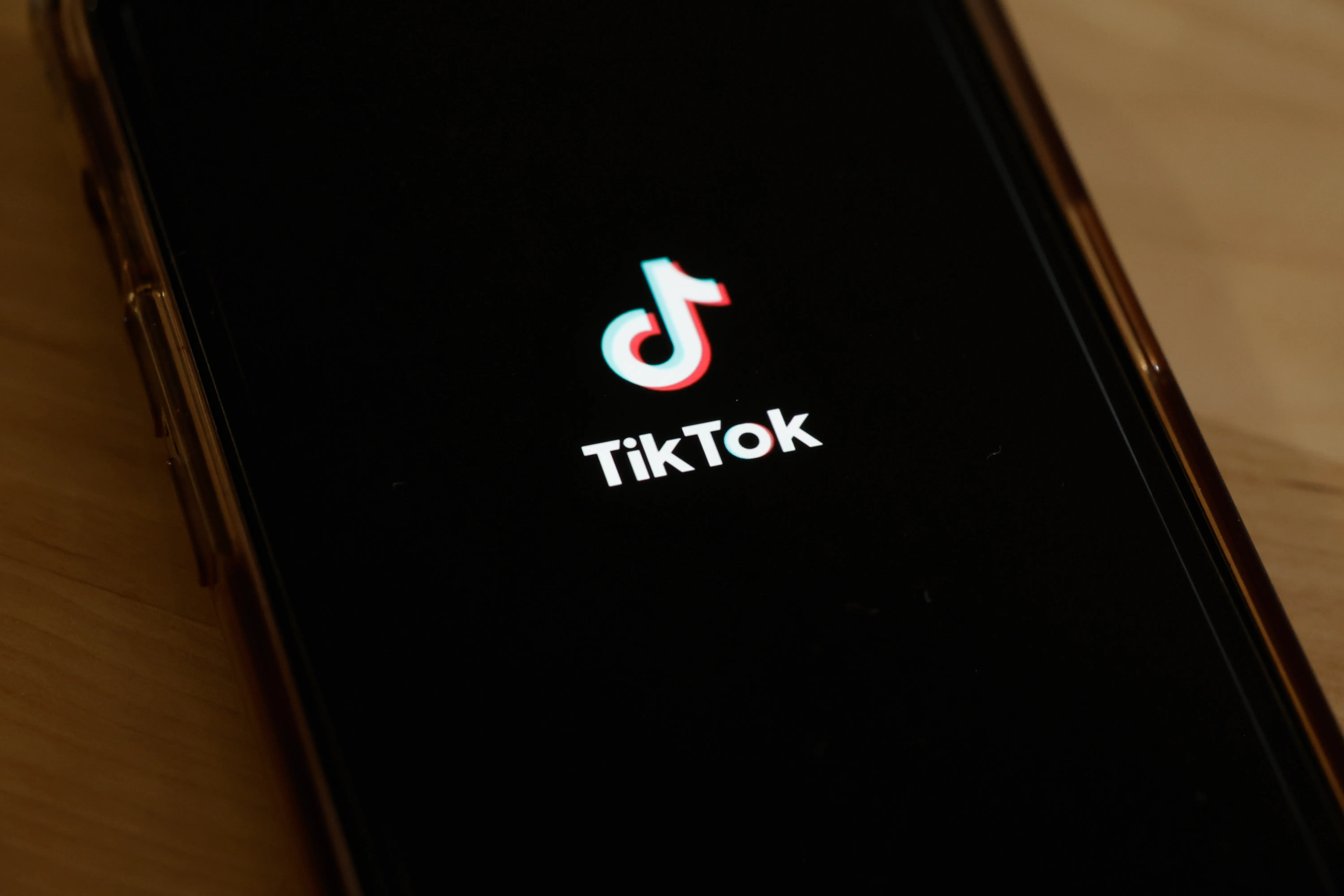 NEW YORK, NEW YORK - MARCH 13: In this photo illustration, the TikTok app is seen on a phone on March 13, 2024 in New York City. Congress is set to vote and pass a bill that could ban the popular app TikTok nationwide and be sent to the Senate for a vote. The bill would force the Chinese firm ByteDance to divest from TikTok and other applications that it owns within six months after passage of the bill or face a ban. Lawmakers argue that ByteDance is beholden to the Chinese government making the app a national security threat. (Photo Illustration by Michael M. Santiago/Getty Images)