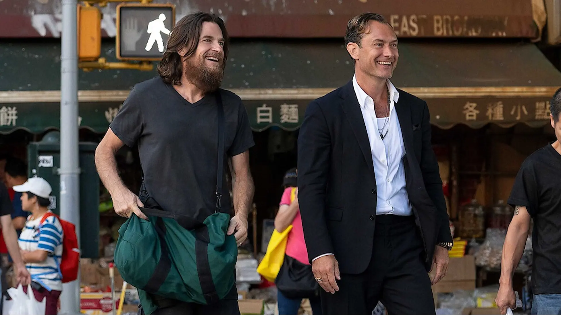 Jude Law and Jason Bateman in a scene from Black Rabbit set in New York’s Chinatown. Image via Netflix.