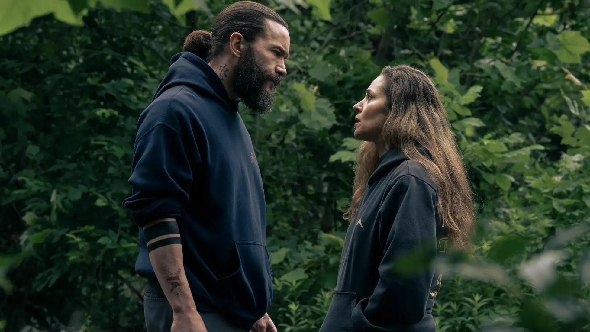 A tense face-off in the woods in Task episode 3 (Nobody’s Stronger Than Forgiveness). Image via HBO MAX.