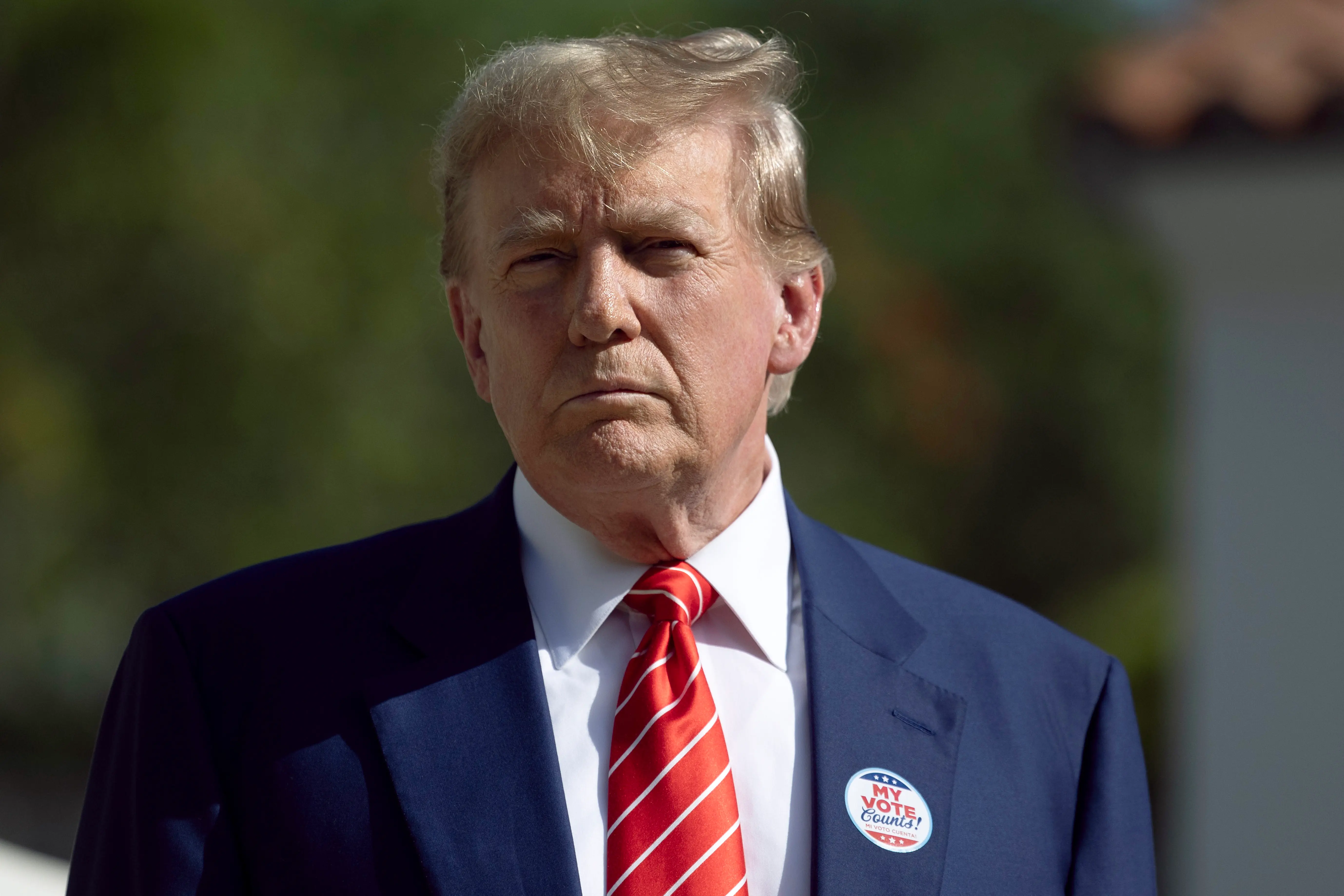 PALM BEACH, FLORIDA - MARCH 19:  Former U.S. President Donald Trump speaks to the media after voting at a polling station setup in the Morton and Barbara Mandel Recreation Center on March 19, 2024, in Palm Beach, Florida.  Trump, along with other registered Republican voters, cast ballots in the Presidential Preference Primary. There wasn't a ballot or election for Democrats since the Florida Democratic Party only provided the name of Joseph R. Biden Jr. (Photo by Joe Raedle/Getty Images)