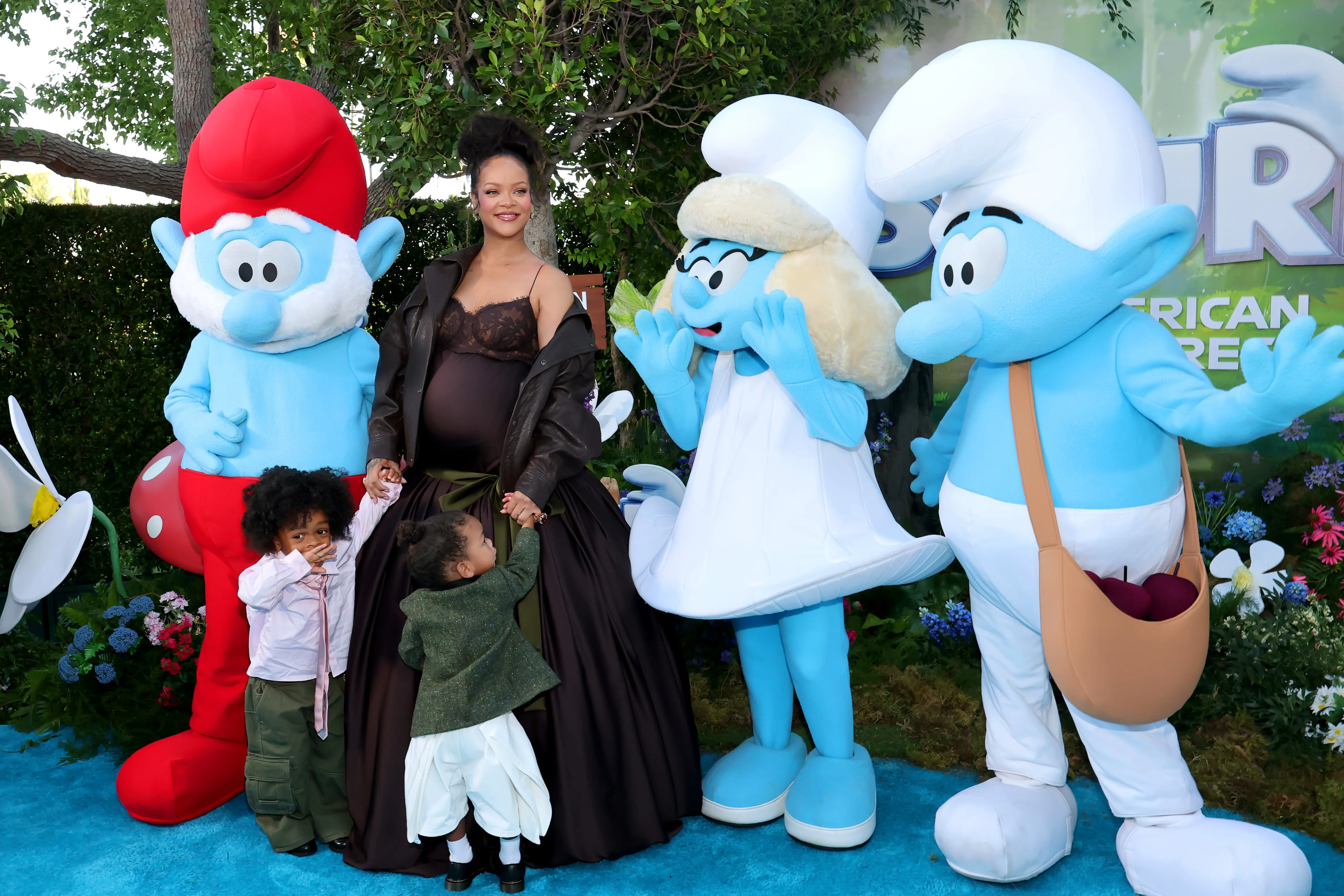 LOS ANGELES, CALIFORNIA - JULY 13: (L-R) RZA Athelston Mayers, Rihanna, and Riot Rose Mayers attend the Los Angeles Premiere of Paramount Pictures “Smurfs” at Paramount Pictures Studios on July 13, 2025 in Los Angeles, California. (Photo by Amy Sussman/Getty Images)