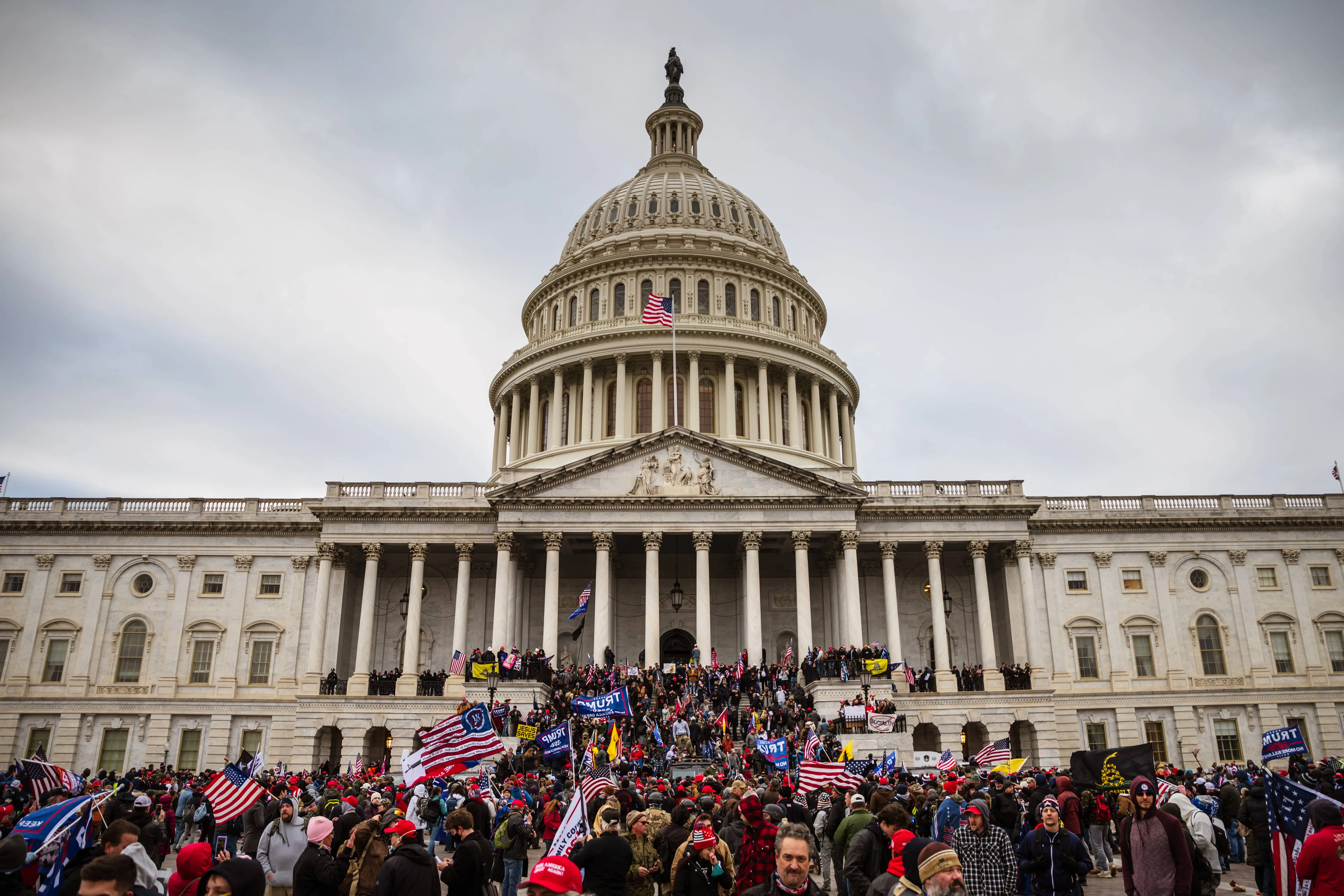 Ray Epps, a pro-Trump supporter, was accused of being an FBI plant at Jan 6 Capitol attack (Image via Jon Cherry/Getty Images)