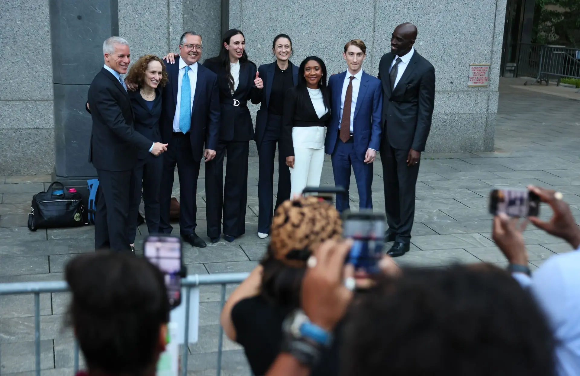 Attorneys for Sean "Diddy" Combs pose for photos at Manhattan Federal Court after Combs' bail hearing following his sex trafficking and racketeering trial on July 02, 2025 in New York City. Combs was found not guilty of racketeering and sex trafficking but convicted of a less serious prostitution charge after a high-profile seven week trial in New York. (Photo by Michael M. Santiago/Getty Images)