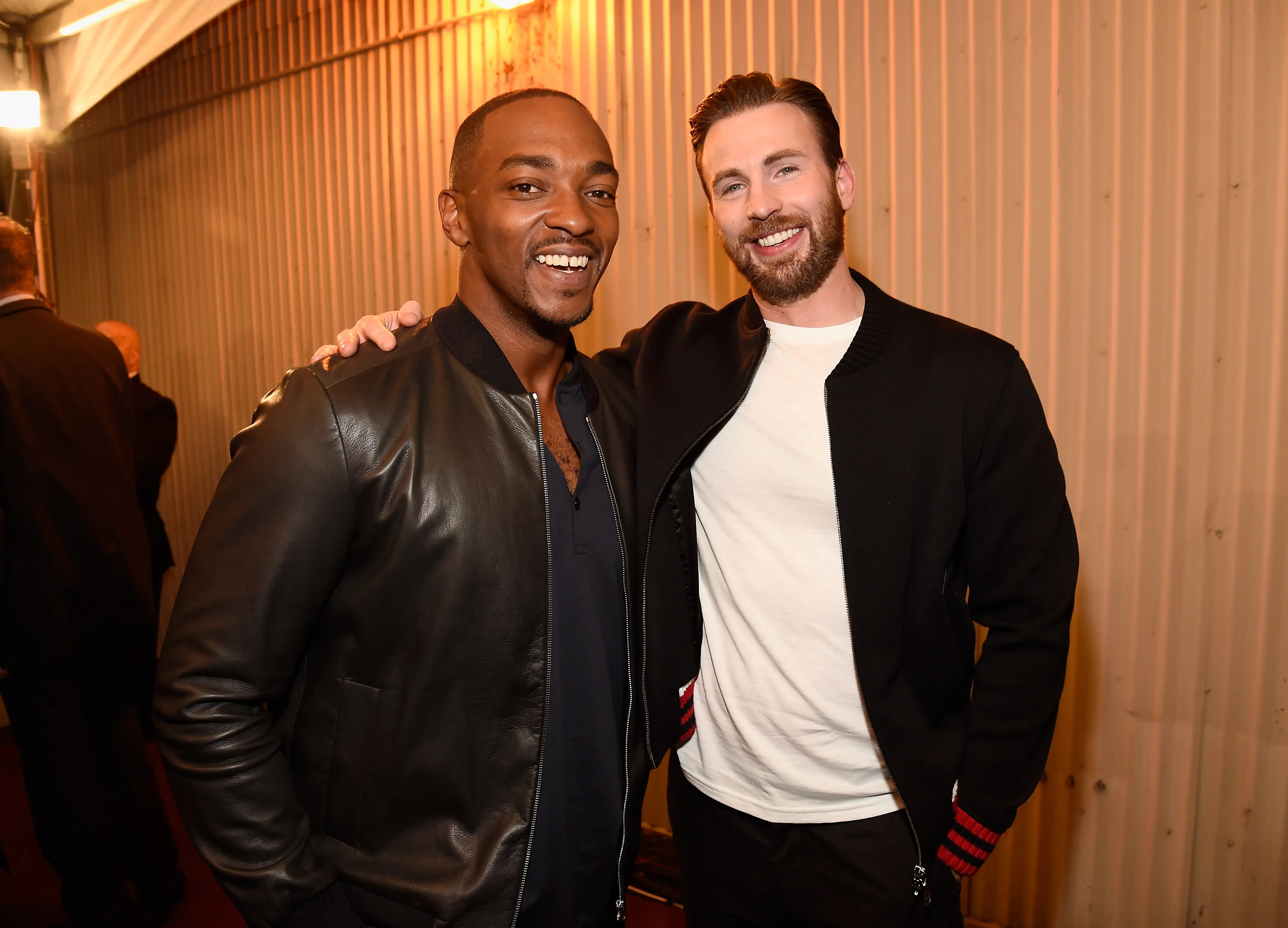 Actors Anthony Mackie (L) and Chris Evans attend the 2016 MTV Movie Awards at Warner Bros. Studios on April 9, 2016 in Burbank, California.  MTV Movie Awards airs April 10, 2016 at 8pm ET/PT.  (Photo by Kevin Mazur/WireImage for MTV)