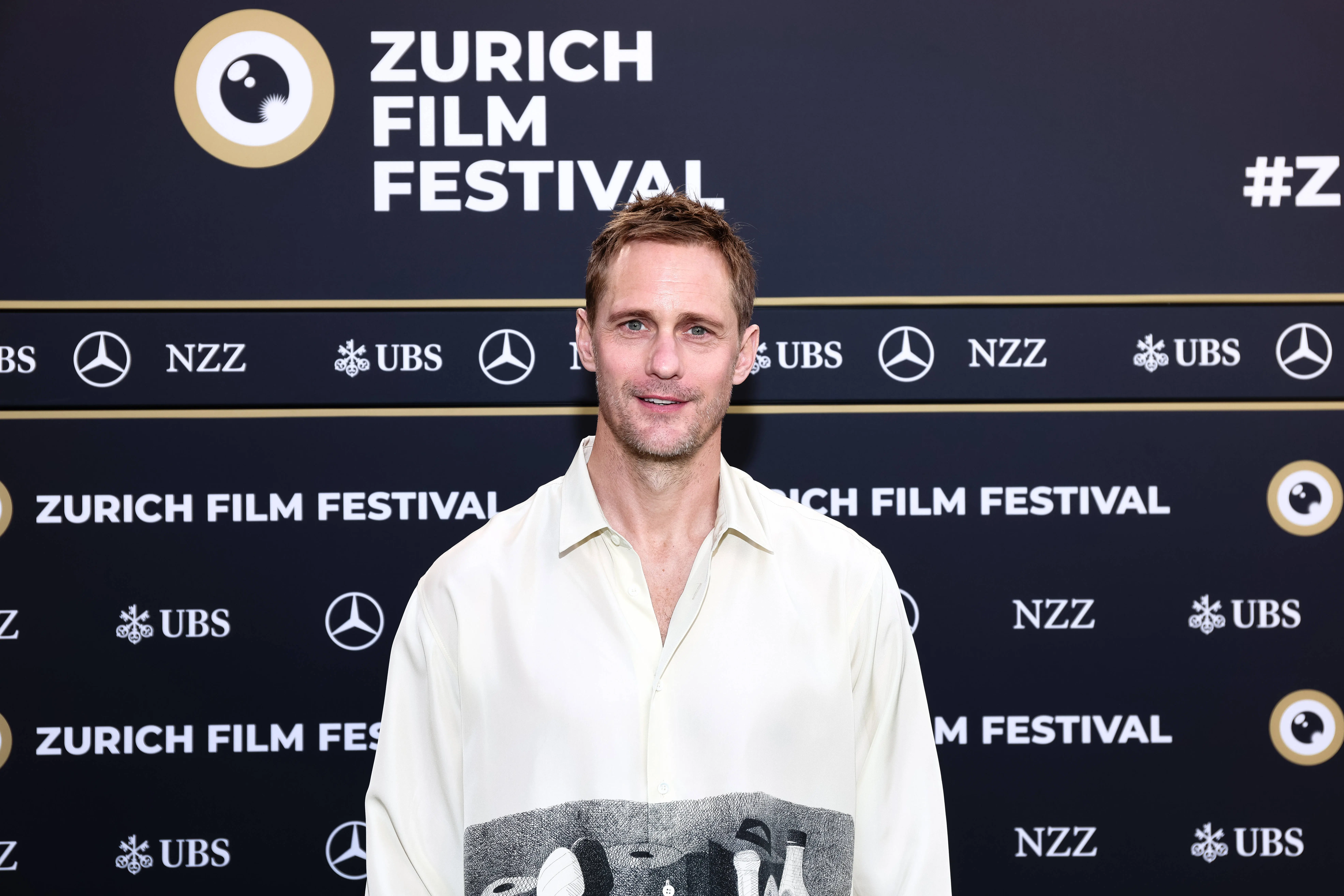Alexander Skarsgard  poses at the "Pillion" photocall during the 21st Zurich Film Festival (Image via Getty)