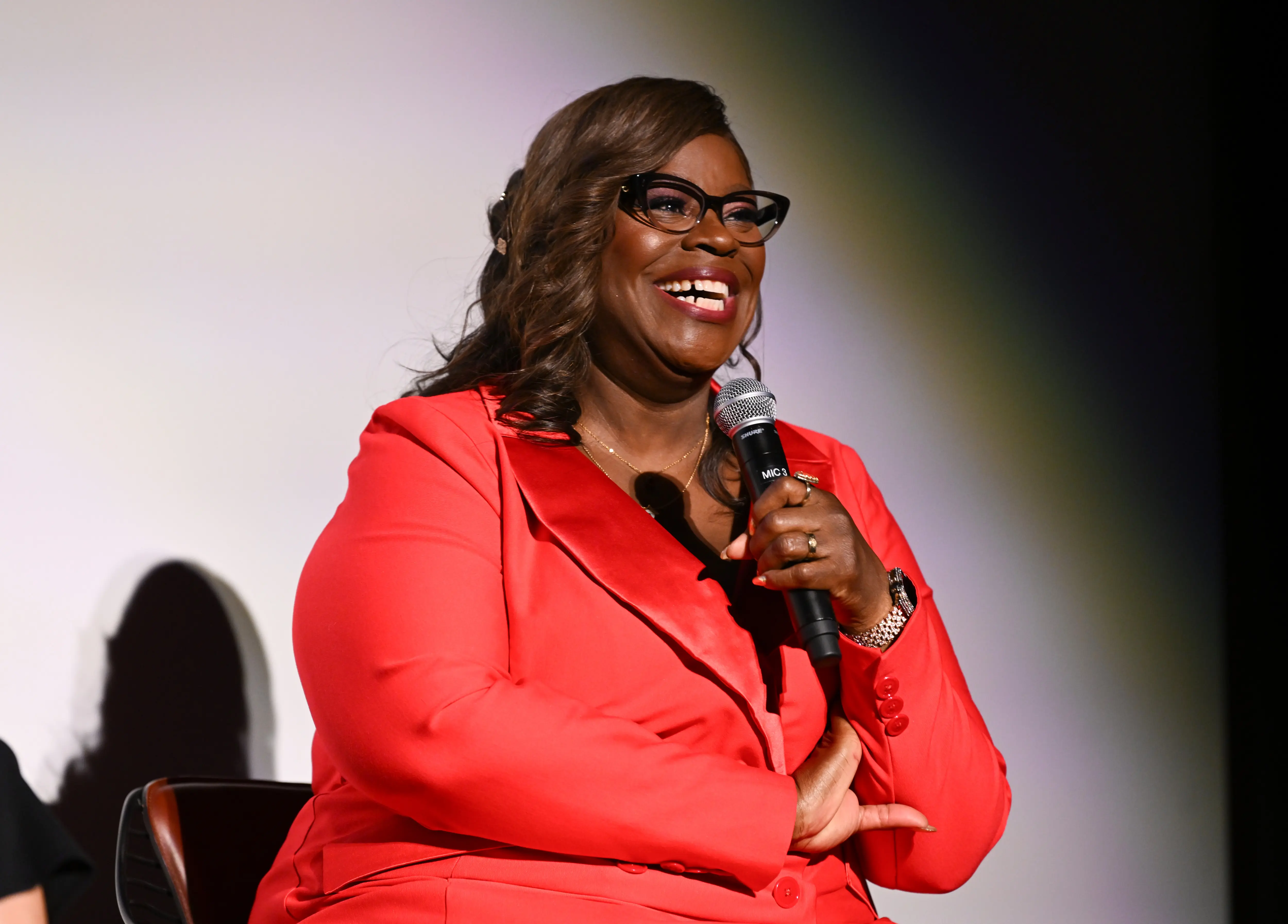 Retta speaks onstage during a Q&amp;A at the Hit Man New York Fan Screening (Image via Getty)