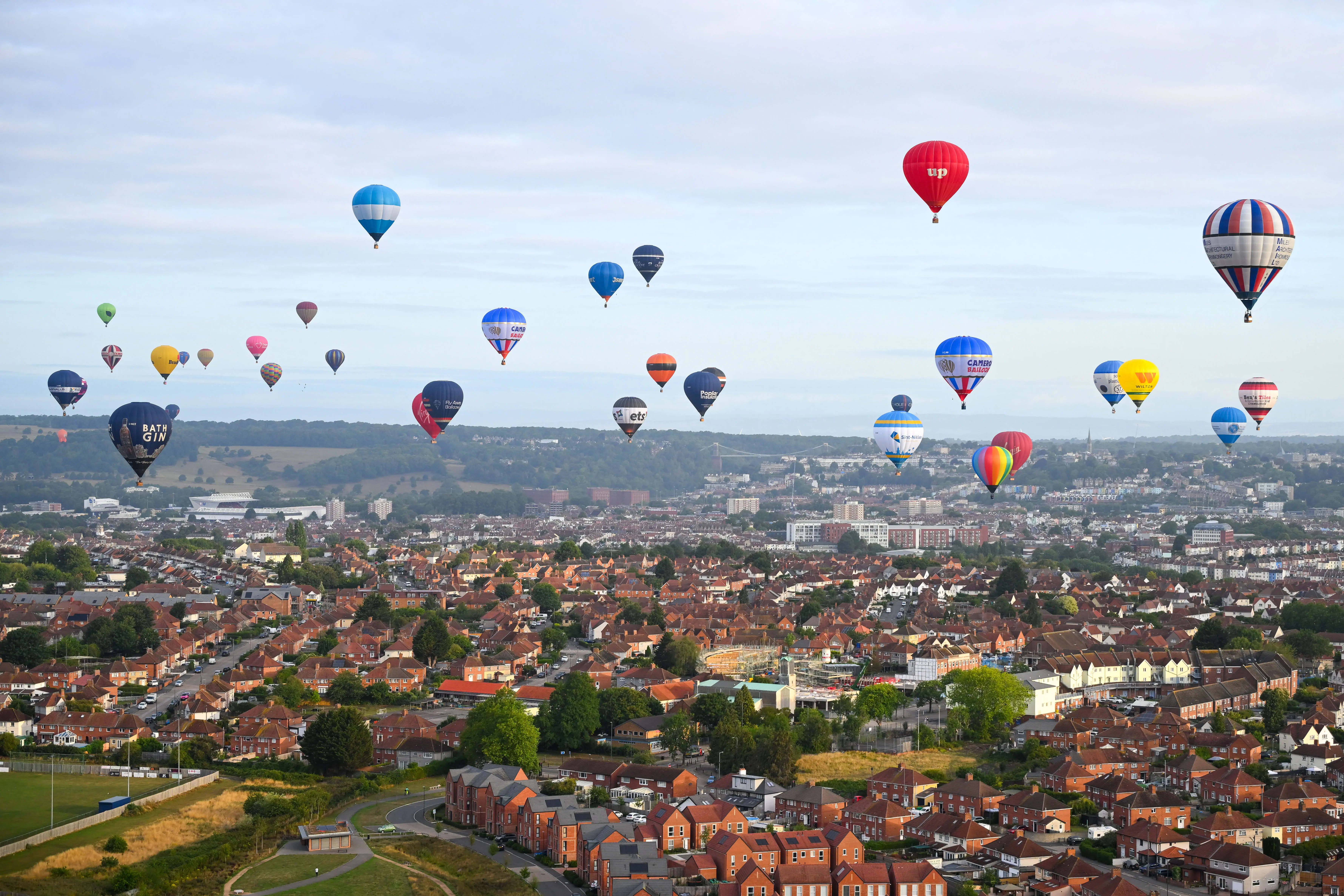 Hot Air balloons take to the sky during a mass ascent (Image via Getty)