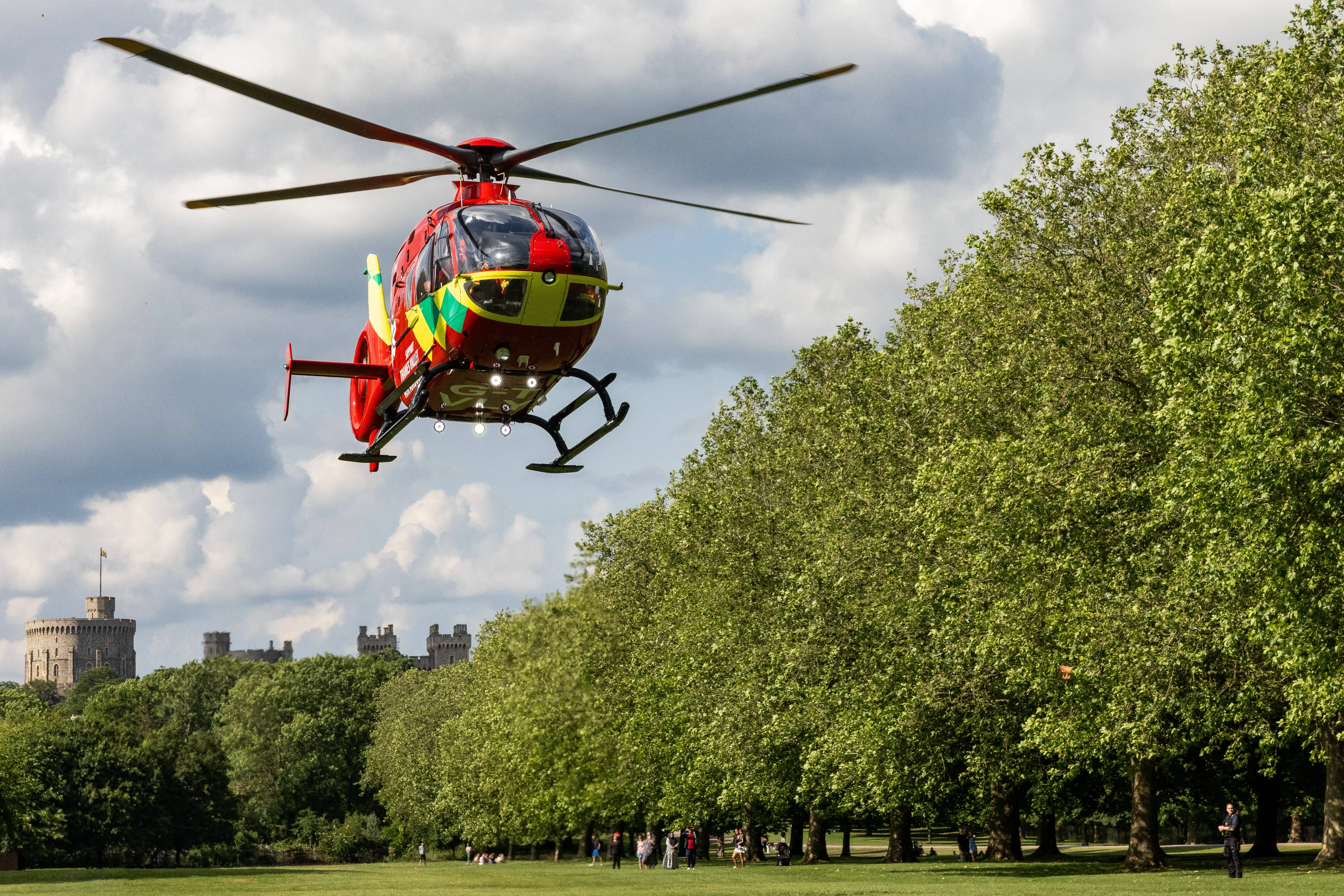 A Thames Valley Air Ambulance crew takes off from alongside the Long Walk in front of Windsor Castle after attending to a nearby road traffic accident on 21 June 2023 in Windsor, United Kingdom. Thames Valley Air Ambulance's new Airbus135 helicopter G-TVLY, which came into service in October 2022, has a top speed of 135mph and is able to reach any part of Berkshire, Buckinghamshire or Oxfordshire within 15 minutes. (photo by Mark Kerrison/In Pictures via Getty Images)
