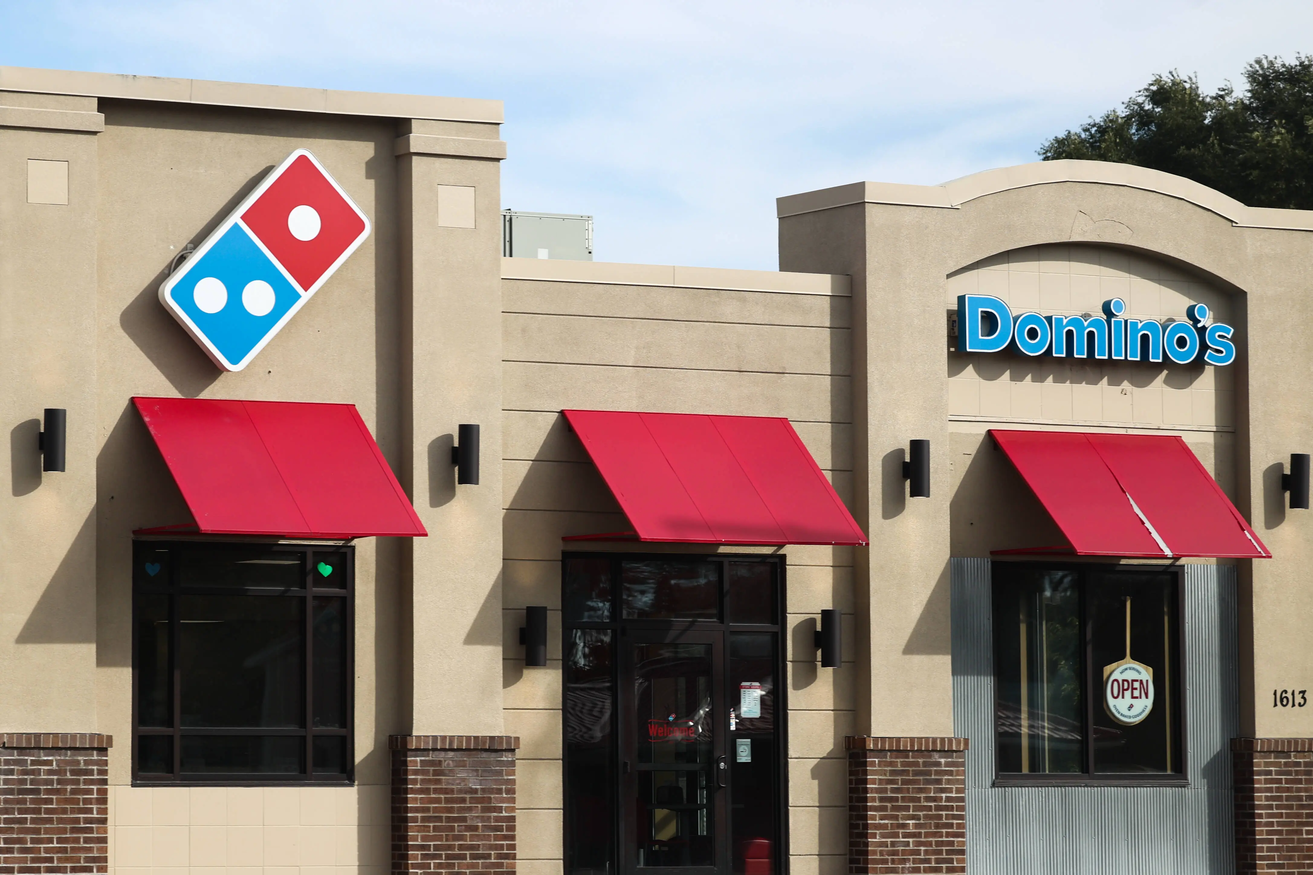 Domino's logo is seen on the restaurant in Streator, United States on October 15, 2022. (Photo by Jakub Porzycki/NurPhoto via Getty Images)