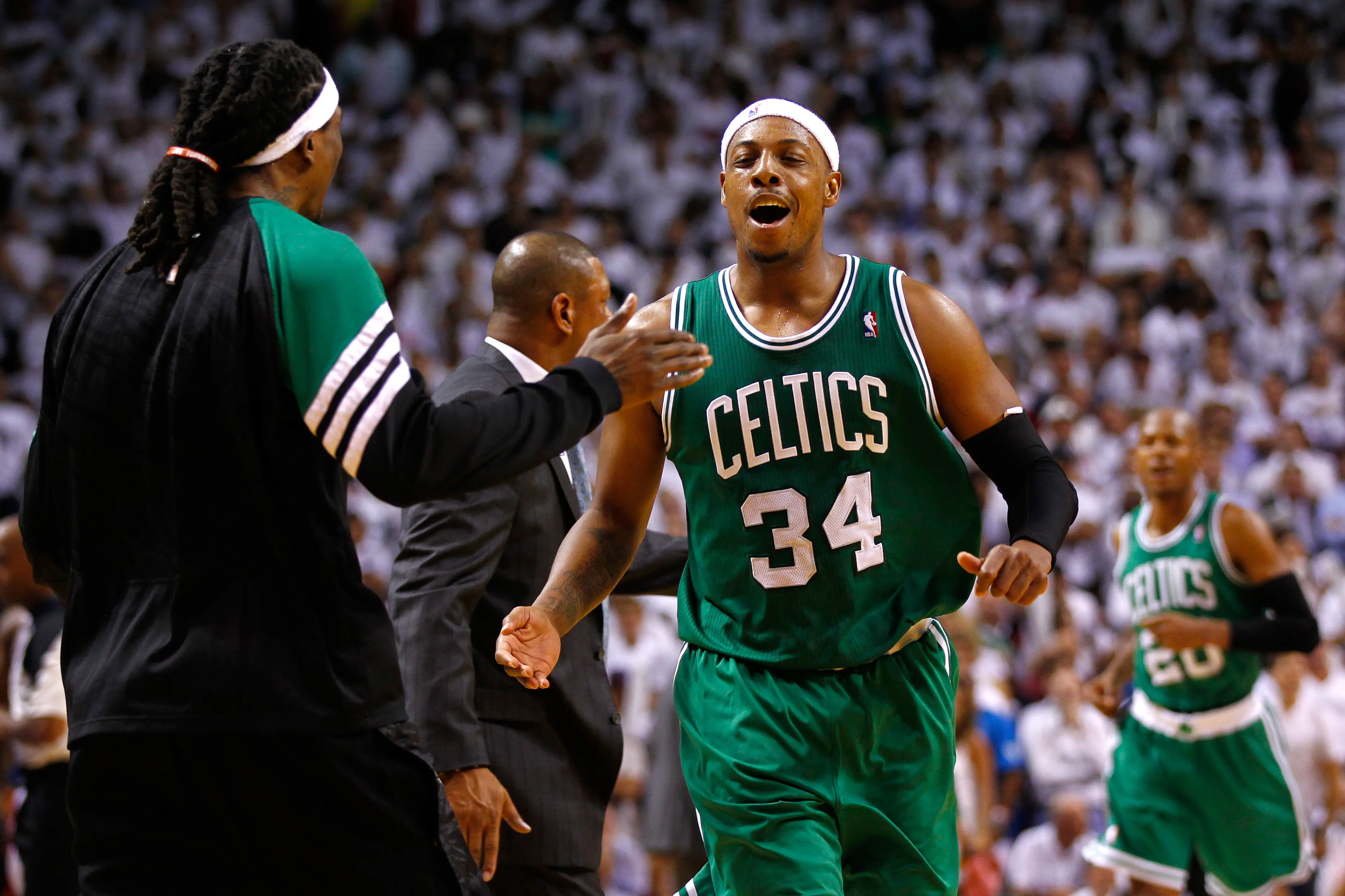 MIAMI, FL - JUNE 05:  Paul Pierce #34 and Marquis Daniels #4 of the Boston Celtics celebrate after Pierce made a 3-point basket in the final minute of the fourt quarter to give the Celtics a 90-86 lead against the Miami Heat  in Game Five of the Eastern Conference Finals in the 2012 NBA Playoffs on June 5, 2012 at American Airlines Arena in Miami, Florida. NOTE TO USER: User expressly acknowledges and agrees that, by downloading and or using this photograph, User is consenting to the terms and conditions of the Getty Images License Agreement.  (Photo by Mike Ehrmann/Getty Images)