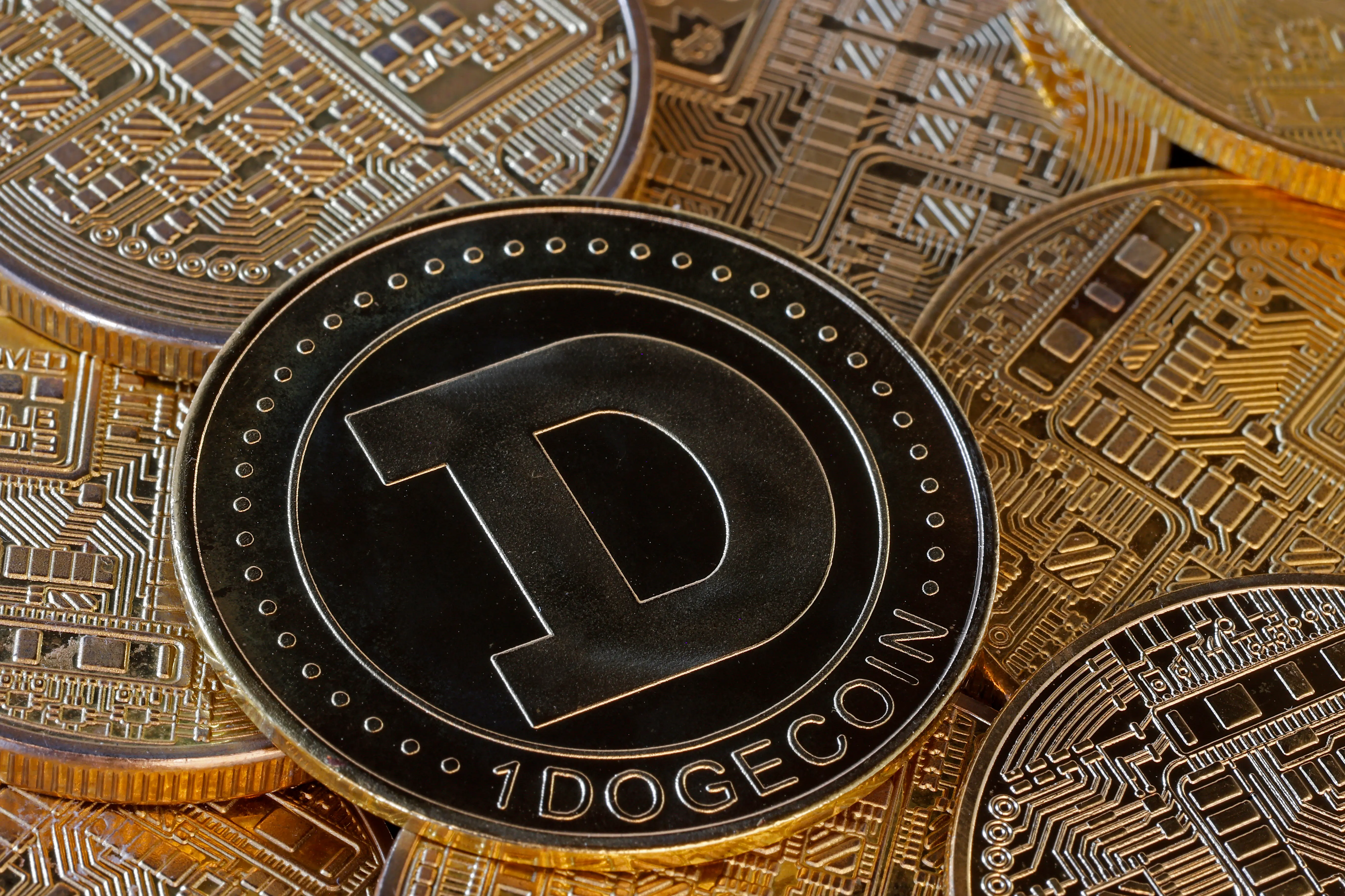 PARIS, FRANCE - NOVEMBER 12: In this photo illustration, a visual representation of the digital Cryptocurrency, Dogecoin (DOGE) is on display on November 12, 2024 in Paris, France. While Donald Trump’s presidential election victory has pushed the price of Bitcoin (BTC) to a new record, cryptocurrency is not the only one exploding. Dogecoin (DOGE) is on a stratospheric trajectory, driven by the possibility of Elon Musk’s arrival in government. (Photo illustration by Chesnot/Getty Images)