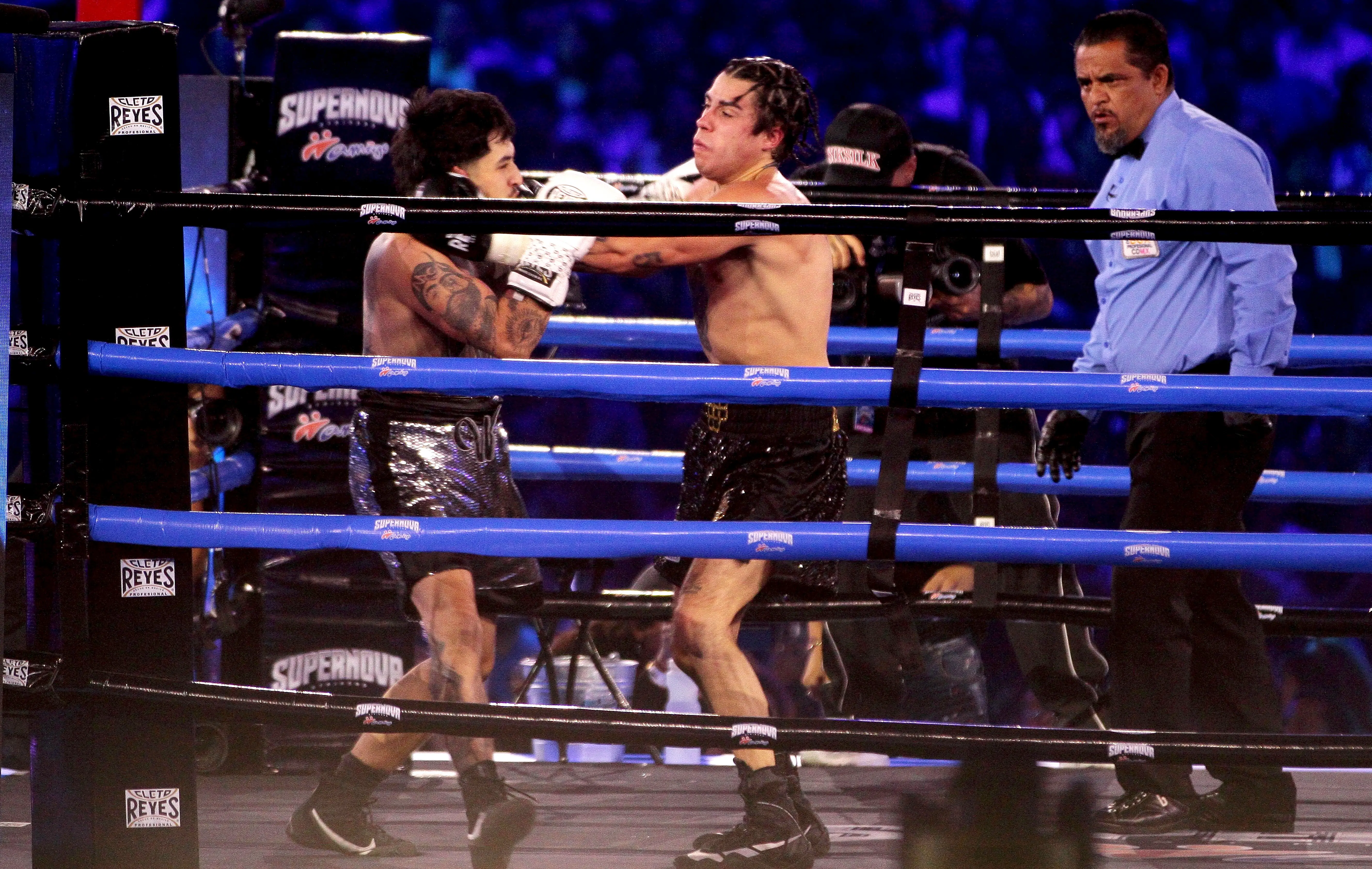MEXICO CITY, MEXICO - AUGUST 17: Westcol and Mario Bautista fight performs as a part of 'Supernova Strikers 2025' at Palacio de los Deprotes on August 17, 2025 in Mexico City, Mexico. (Photo by Medios y Media/Getty Images)
