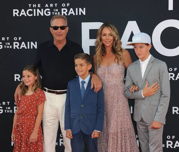 LOS ANGELES, CA - AUGUST 01: Grace Avery Costner, Kevin Costner, Hayes Logan Costner, Christine Baumgartner and Cayden Wyatt Costner arrive for the Premiere Of 20th Century Fox's "The Art Of Racing In The Rain" held at El Capitan Theatre on August 1, 2019 in Los Angeles, California. (Photo by Albert L. Ortega/Getty Images)