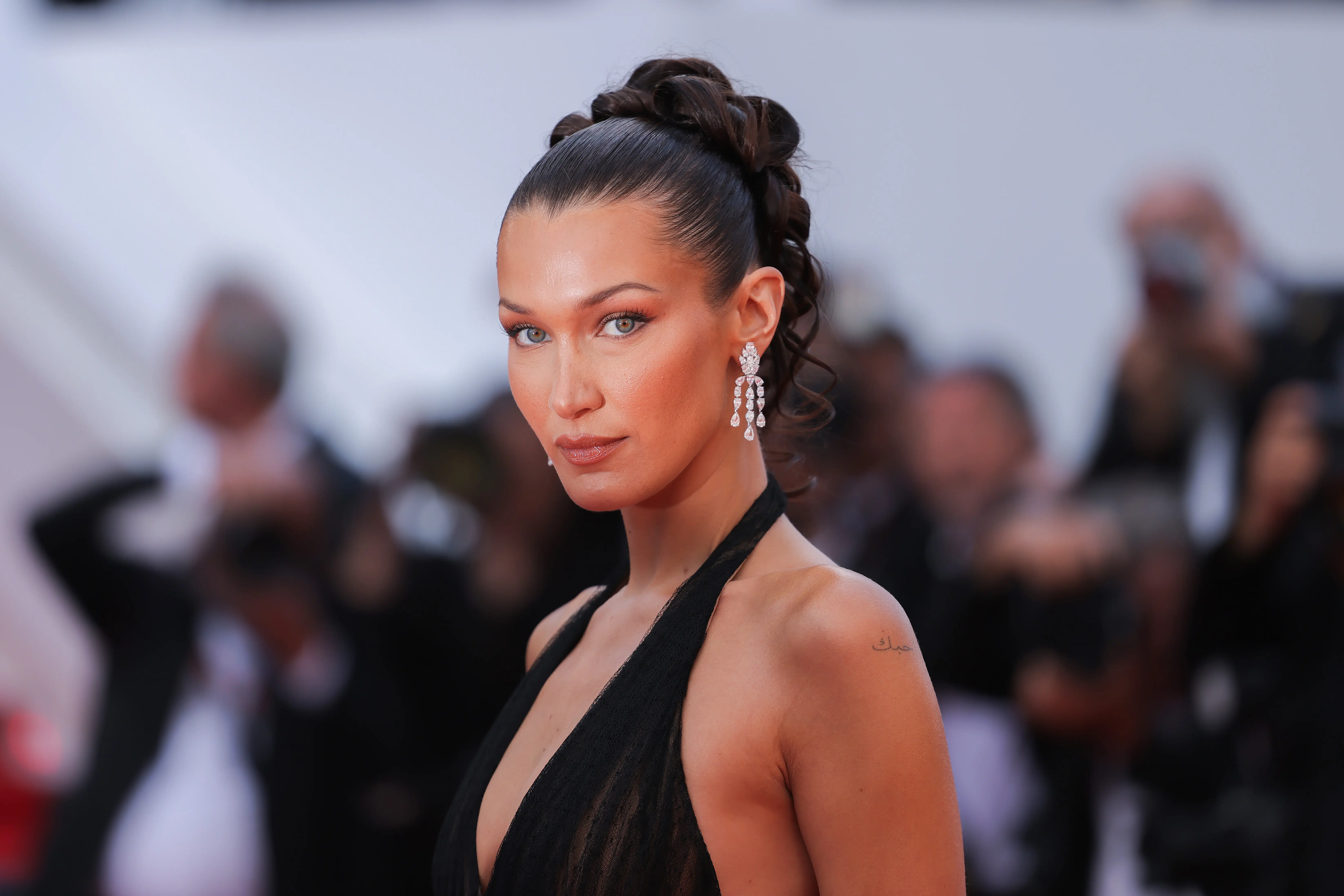 Bella Hadid attends the "L'Amour Ouf" (Beating Hearts) Red Carpet at the 77th annual Cannes Film Festival at Palais des Festivals (Image via Getty)