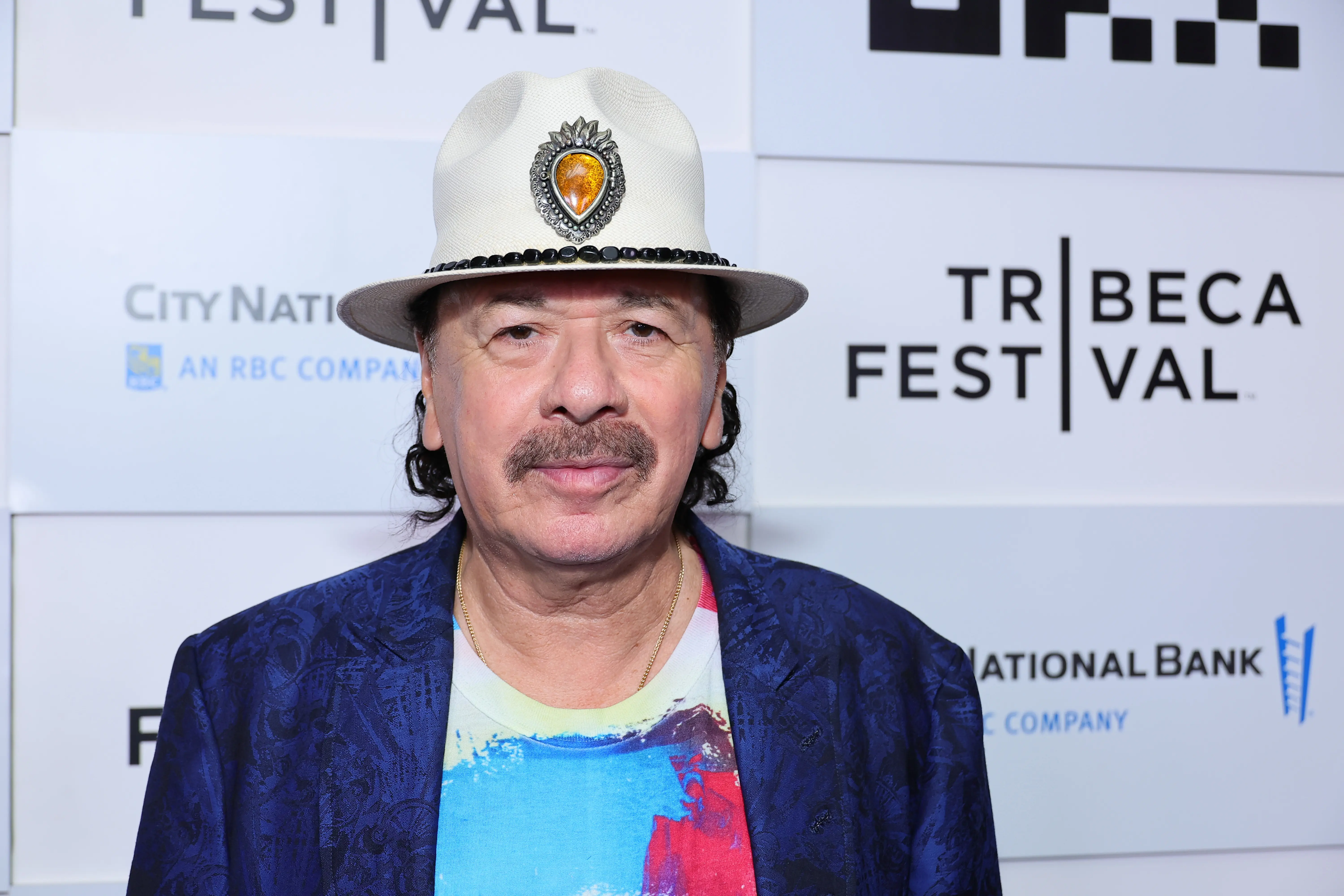 Carlos Santana has not responded to the ongoing rumors until now (Image via Getty)