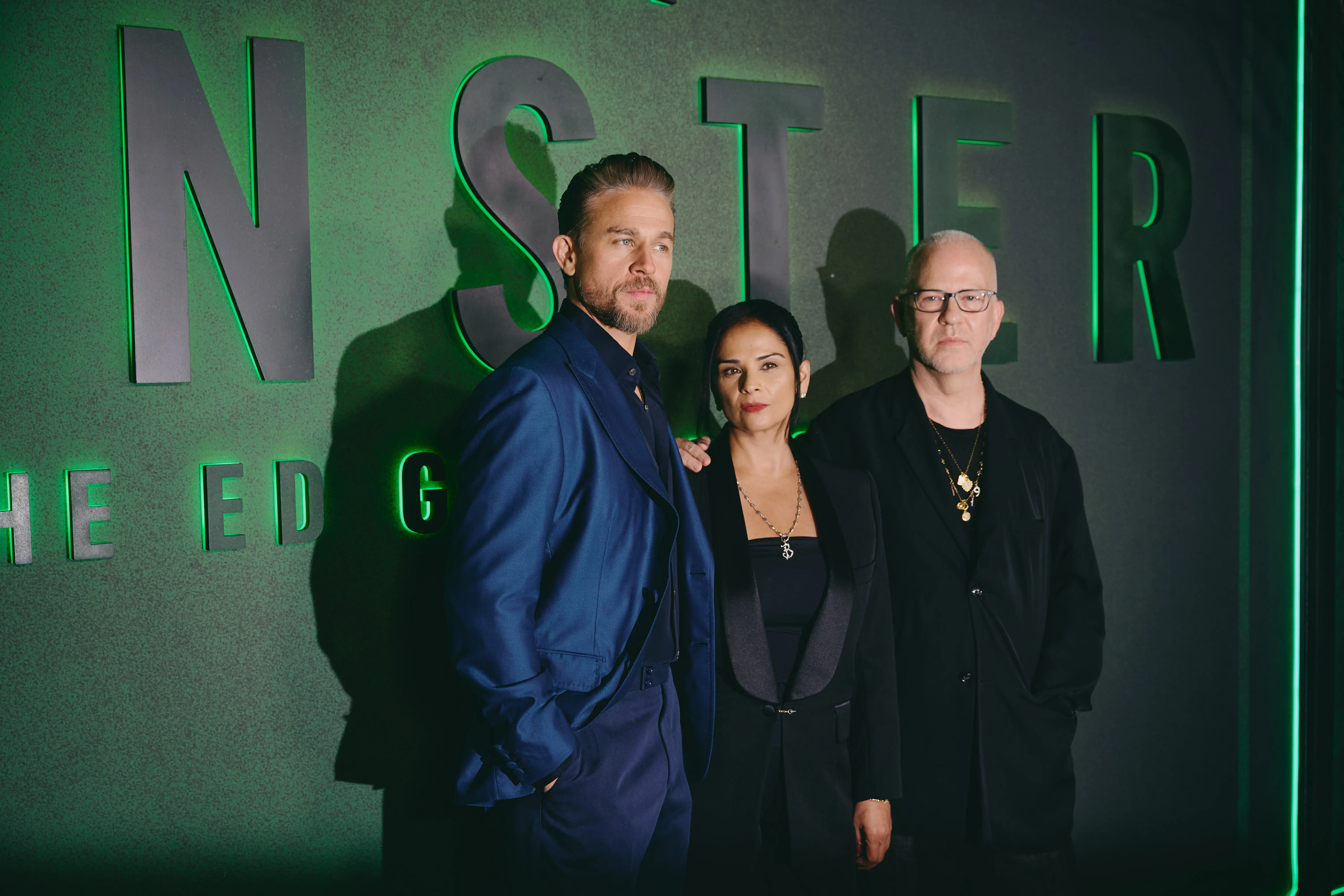 NEW YORK, NEW YORK - SEPTEMBER 30: (L-R) Charlie Hunnam, Bela Bajaria, and Ryan Murphy attend the Monster: The Ed Gein Story NY Premiere at Paris Theater on September 30, 2025 in New York City. (Photo by Jenny Anderson/Getty Images for Netflix)