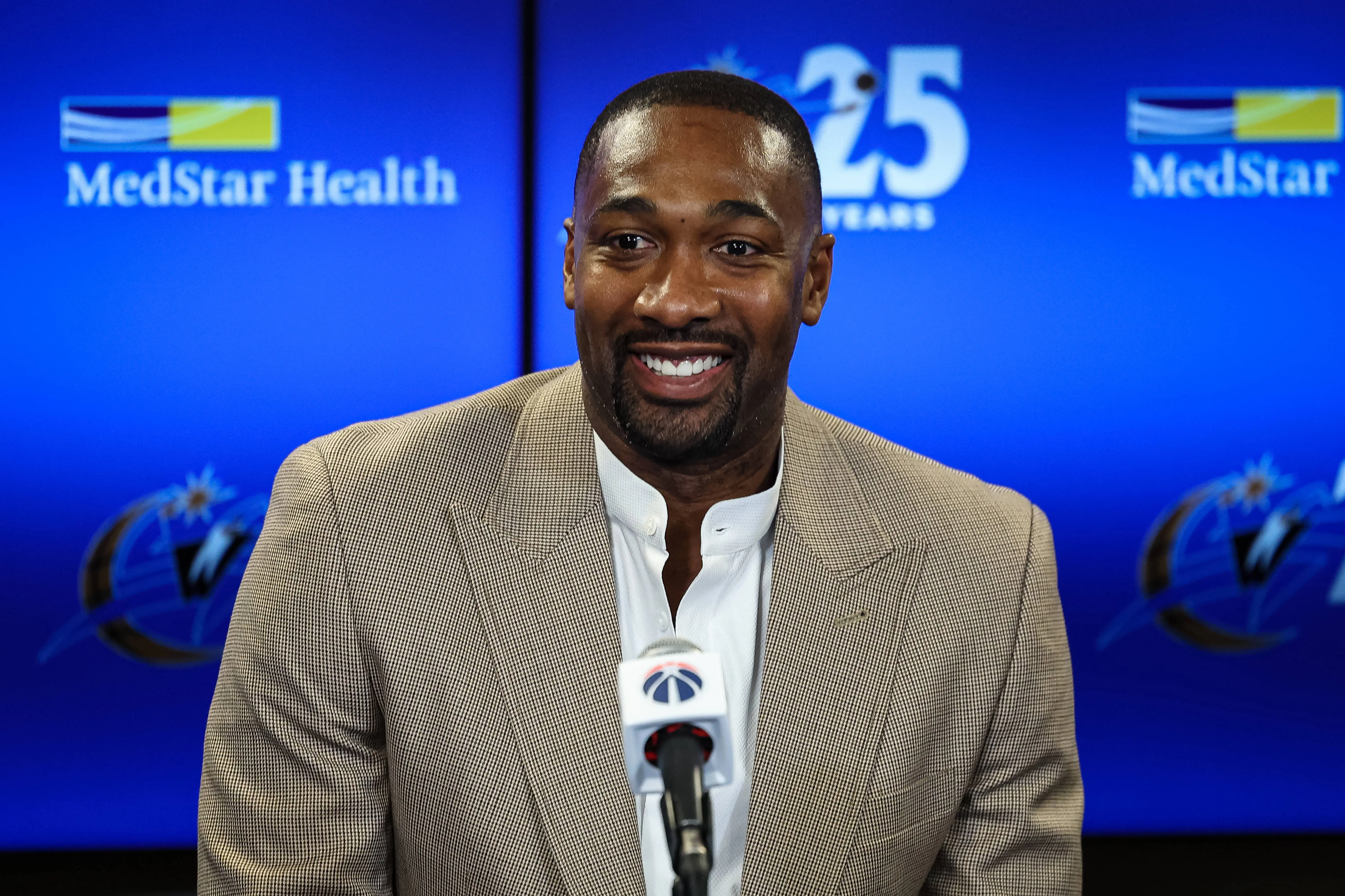 Former Washington Wizards player Gilbert Arenas addresses the media before the game between the Washington Wizards and the Miami Heat (Image via Getty)