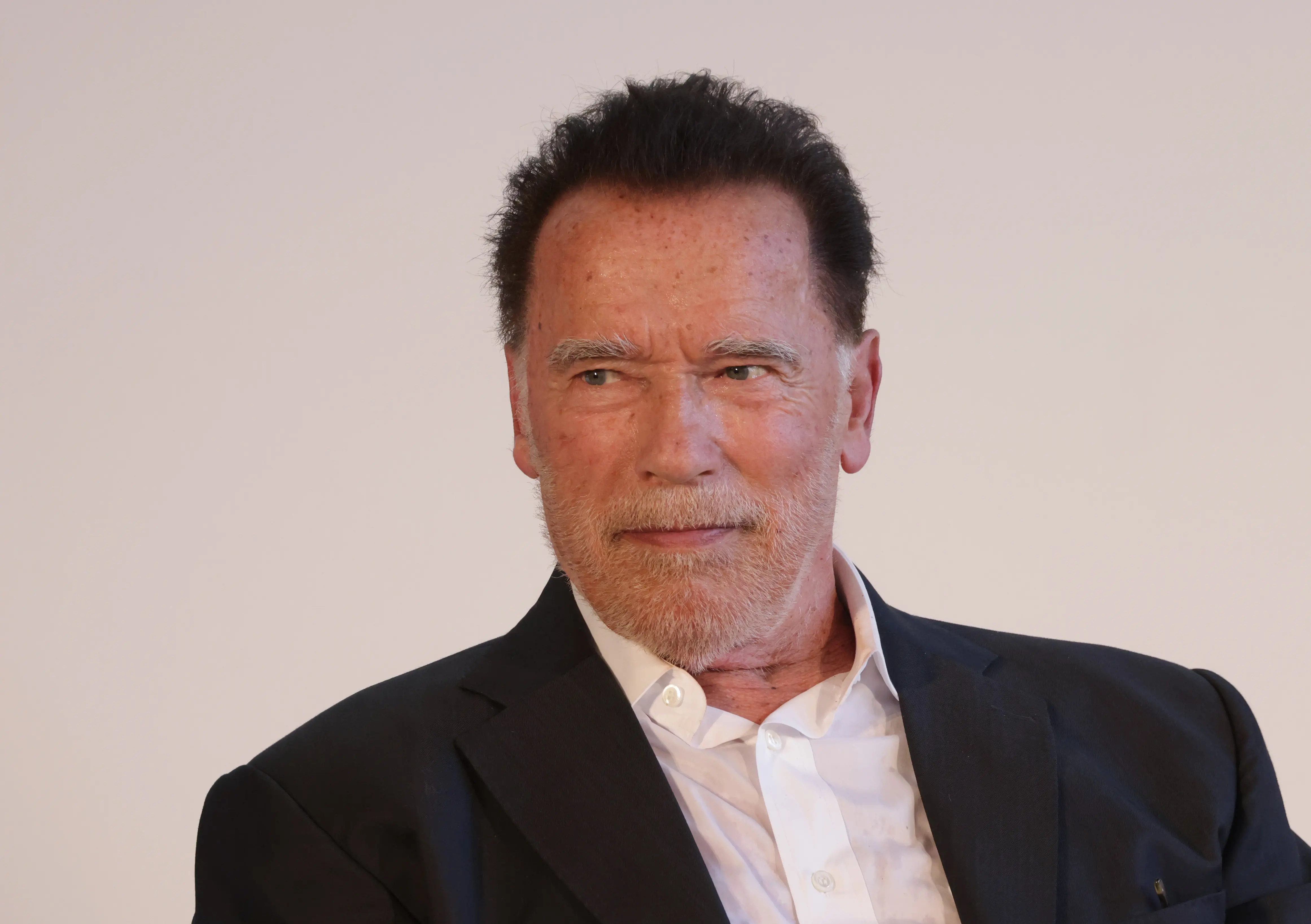 BERLIN, GERMANY - SEPTEMBER 17: Former California Governor Arnold Schwarzenegger speaks to students after he received an honorary degree from the Hertie School at an event at the Hertie School on September 17, 2024 in Berlin, Germany. The award is in honour of Schwarzenegger's commitment to climate protection and civil society.  (Photo by Sean Gallup/Getty Images)