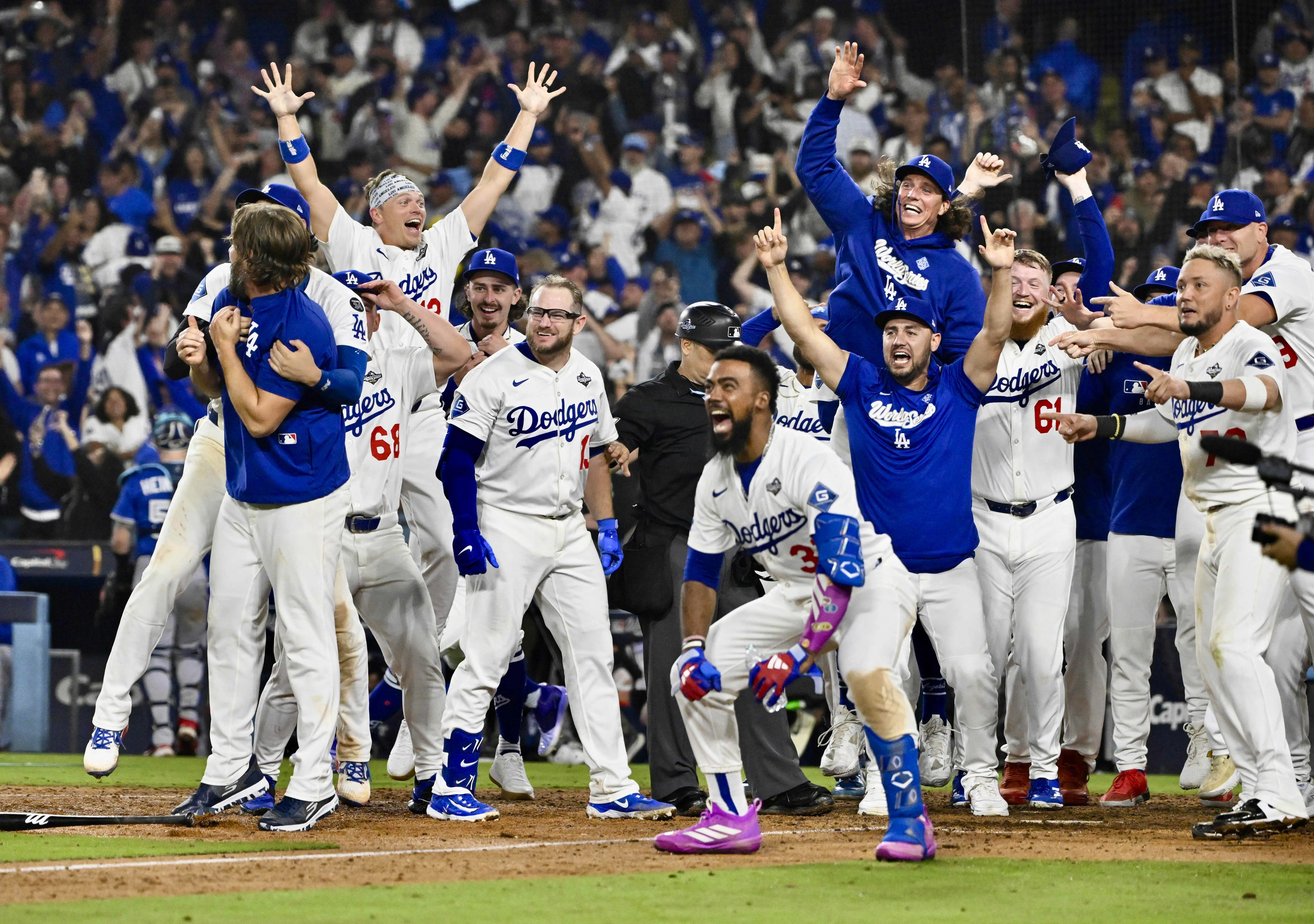 Los Angeles, CA - October 27:  Teammates wait for Freddie Freeman #5 of the Los Angeles Dodgers after he hit a walk off home run in the eighteenth inning to win game 3 of a World Series baseball game 6-5 against the Toronto Blue Jays at Dodger Stadium in Los Angeles on Monday, October 27, 2025. (Photo by Keith Birmingham/MediaNews Group/Pasadena Star-News via Getty Images)