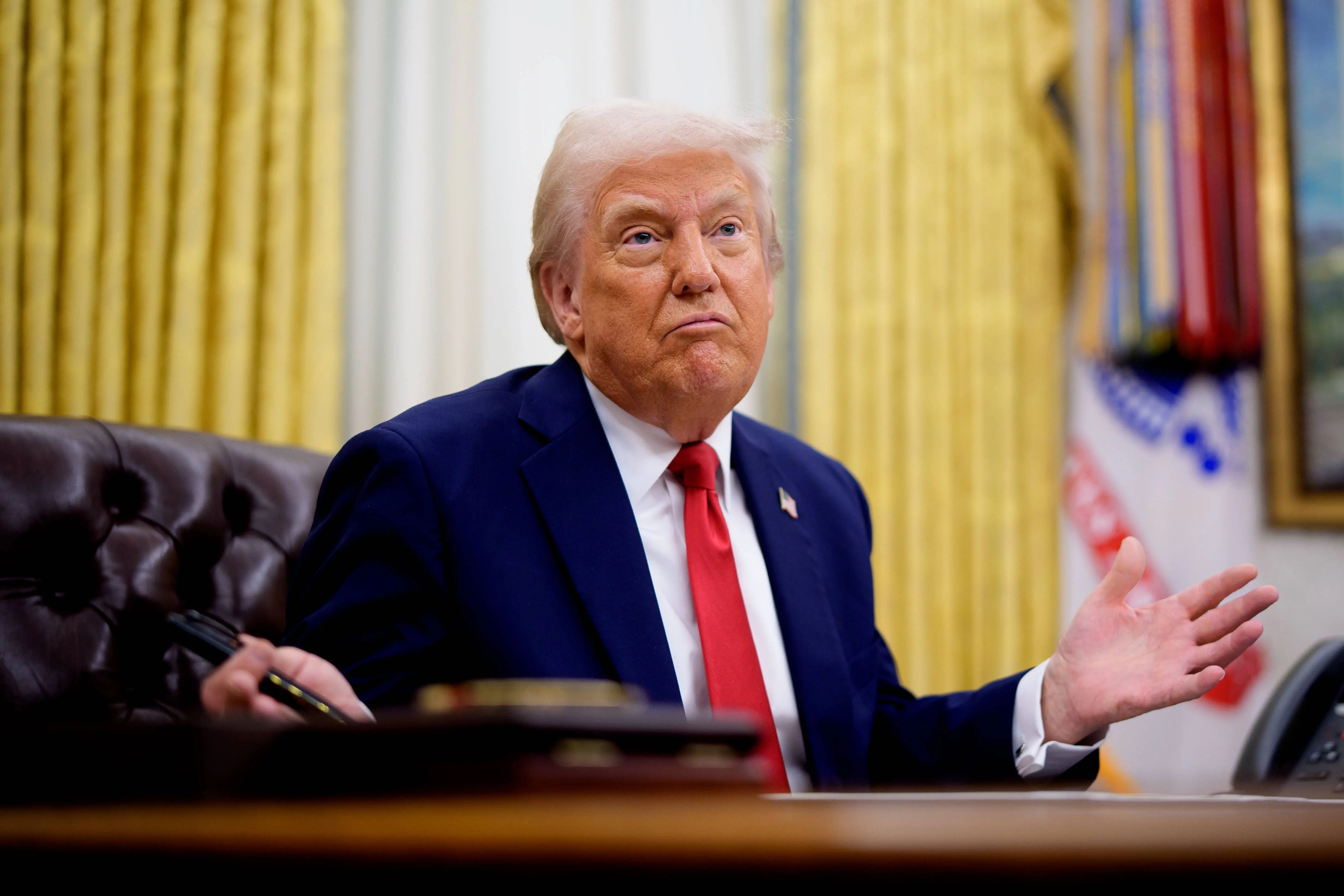 US President Donald Trump gestures while speaking during an executive order signing event in the Oval Office of the White House on March 31, 2025 in Washington, DC. (Photo by Andrew Harnik/Getty Images)
